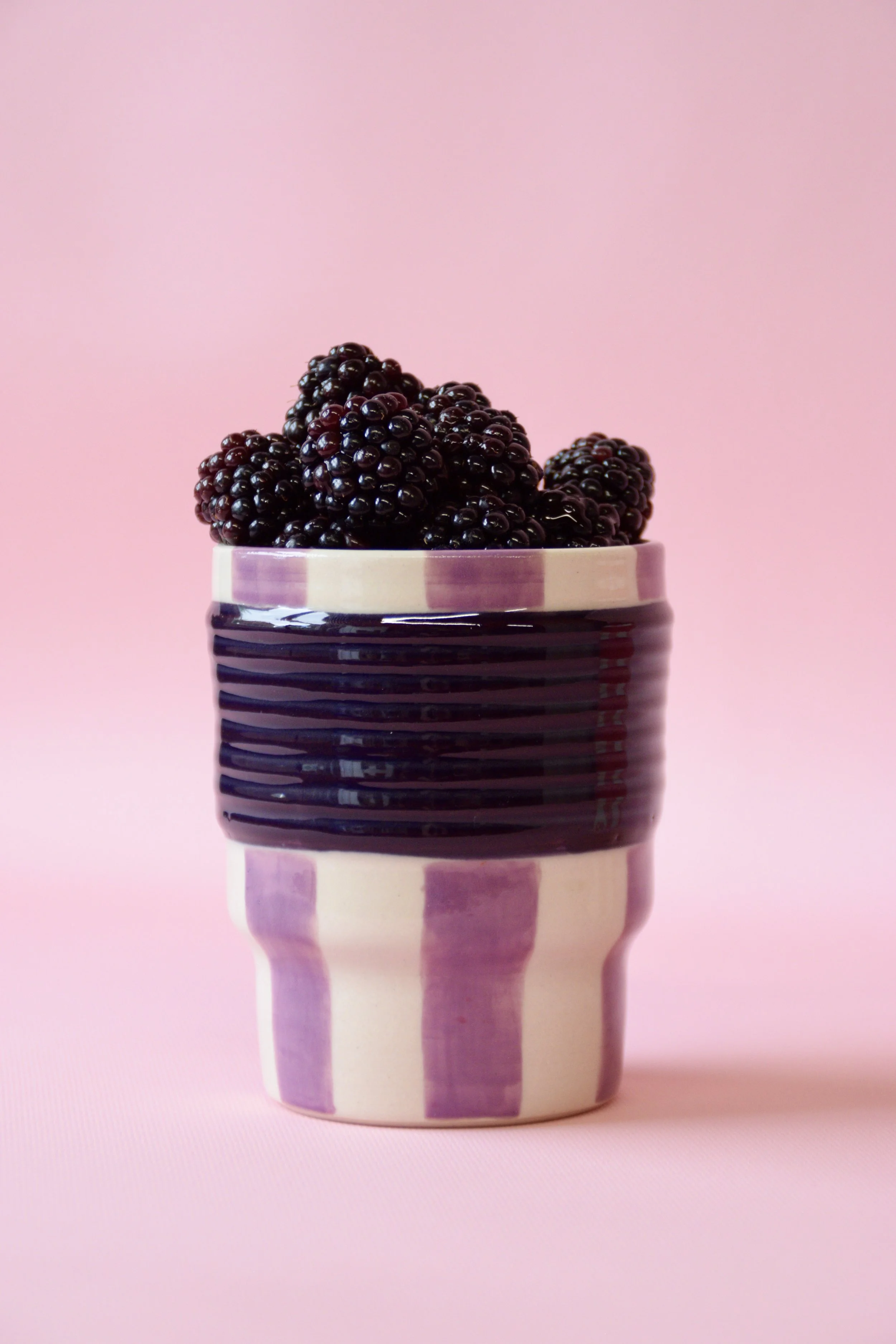 Purple striped ceramic tumbler with blackberries