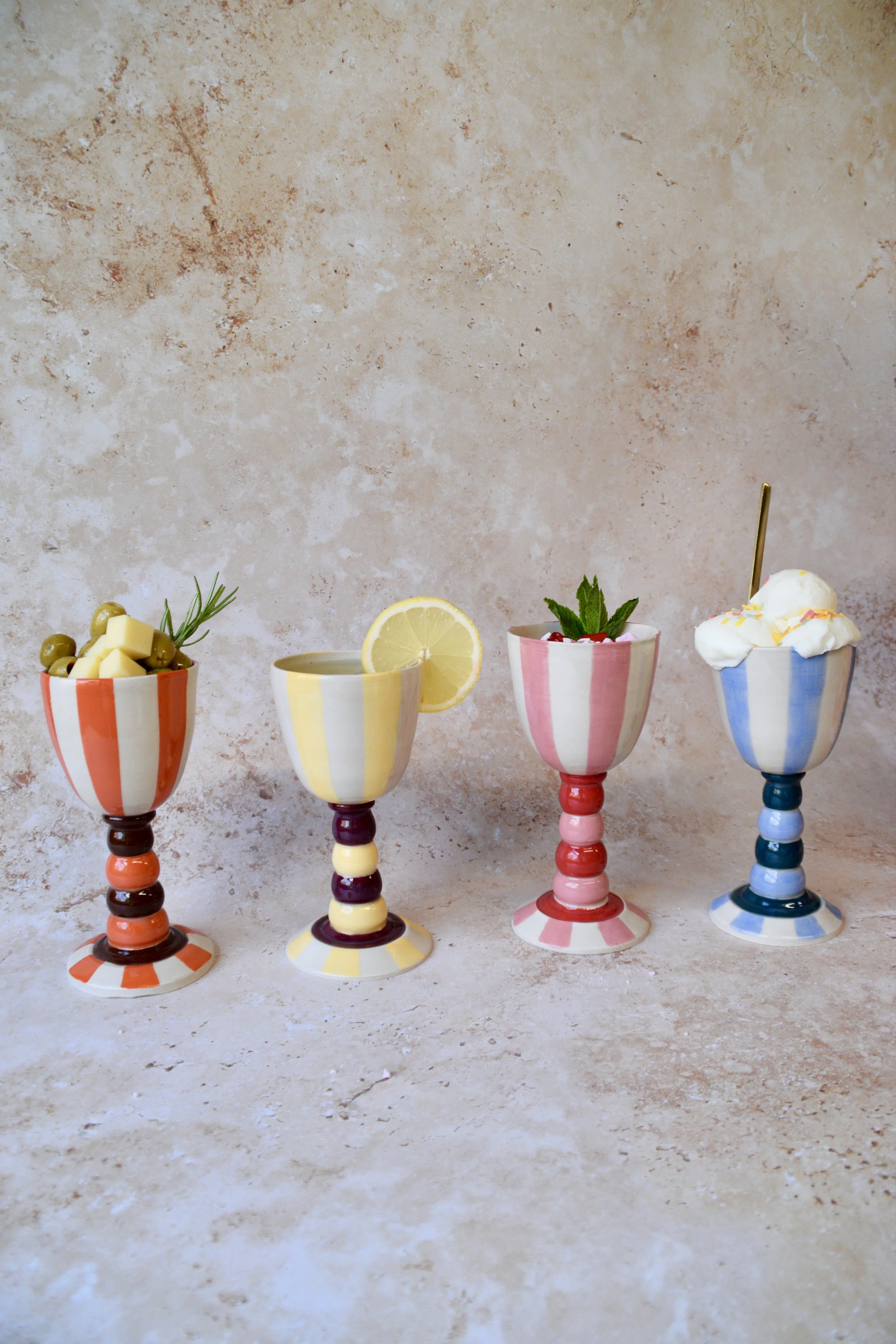 Four handmade striped ceramic goblets in different colourways