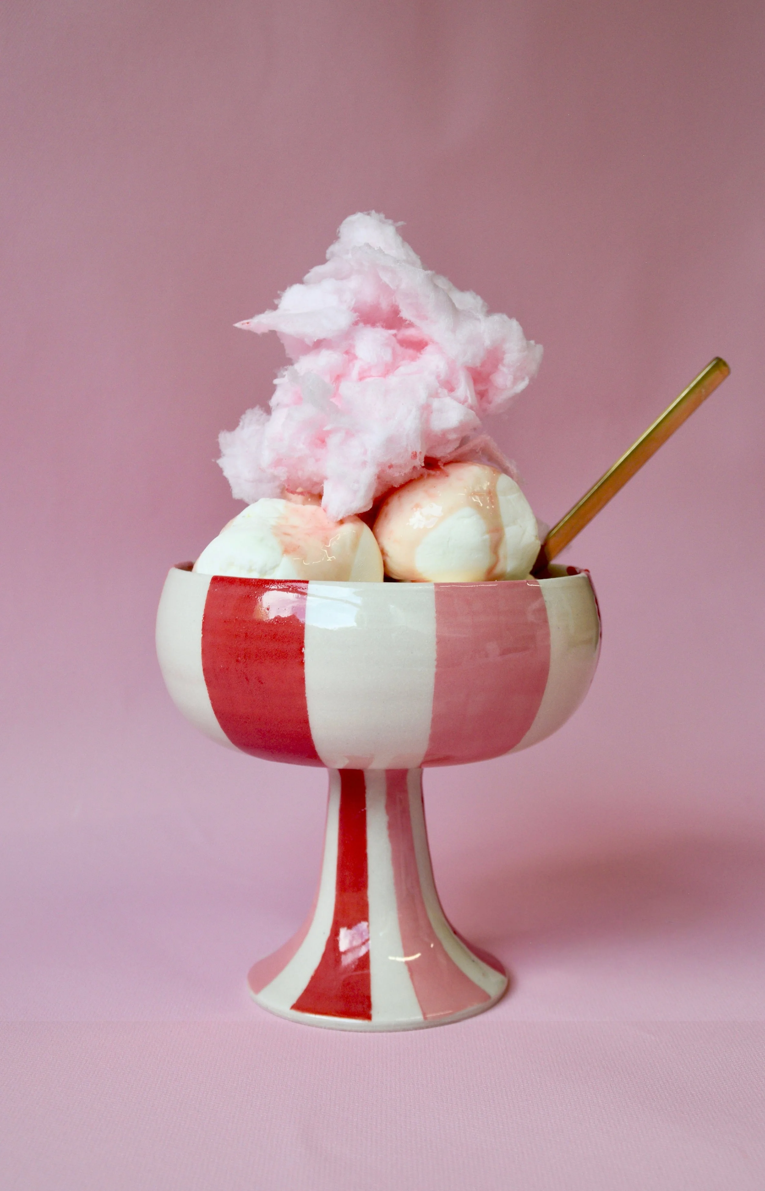 Pink and red striped ceramic dessert bowl with ice cream