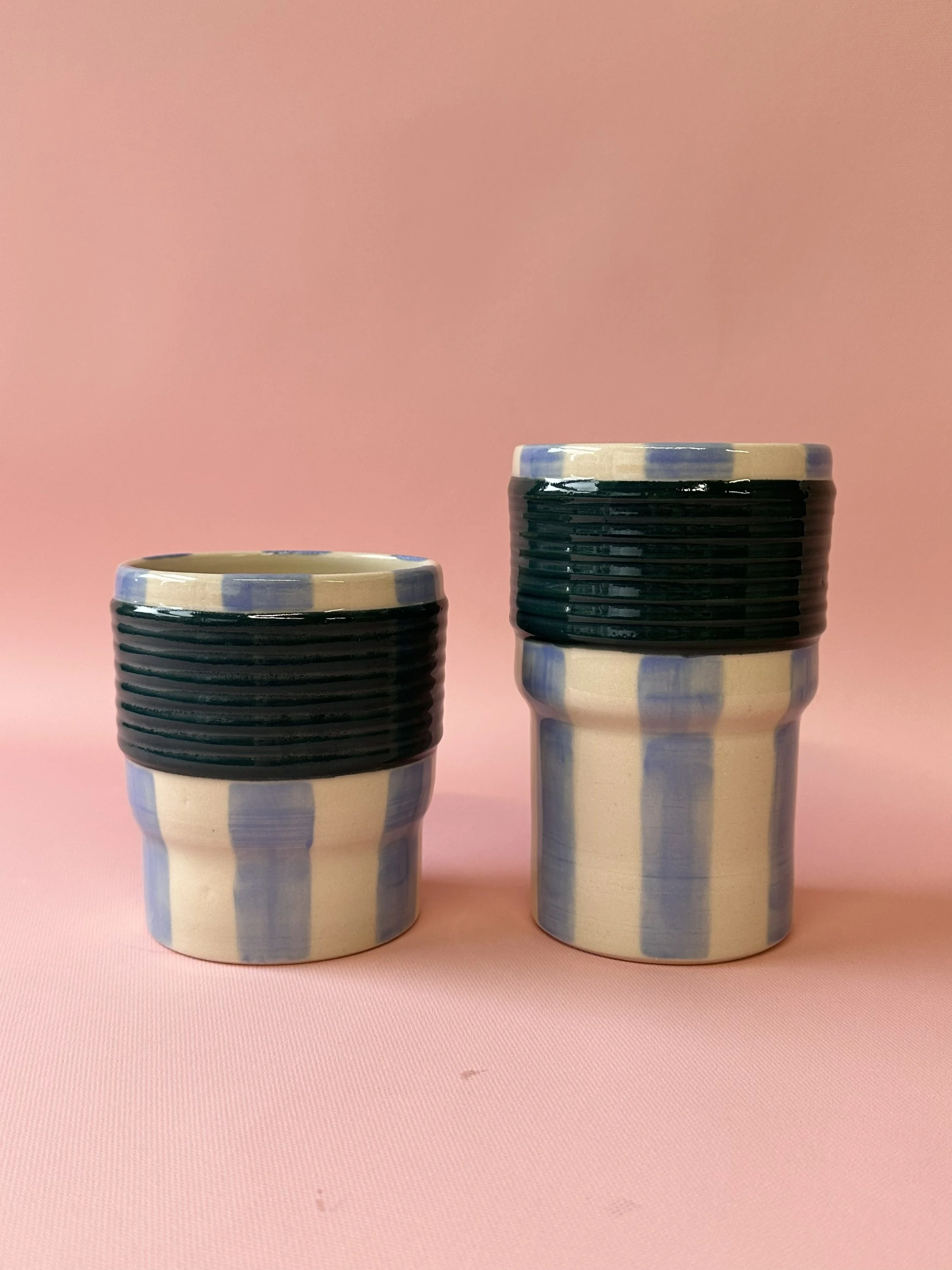Large and small blue striped ceramic tumblers