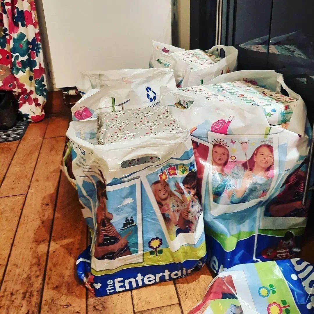 Excitedly getting ready for Father Christmas&rsquo; final visit to the lucky children at our New Year&rsquo;s party this weekend! 59 gifts wrapped and ready for distribution!