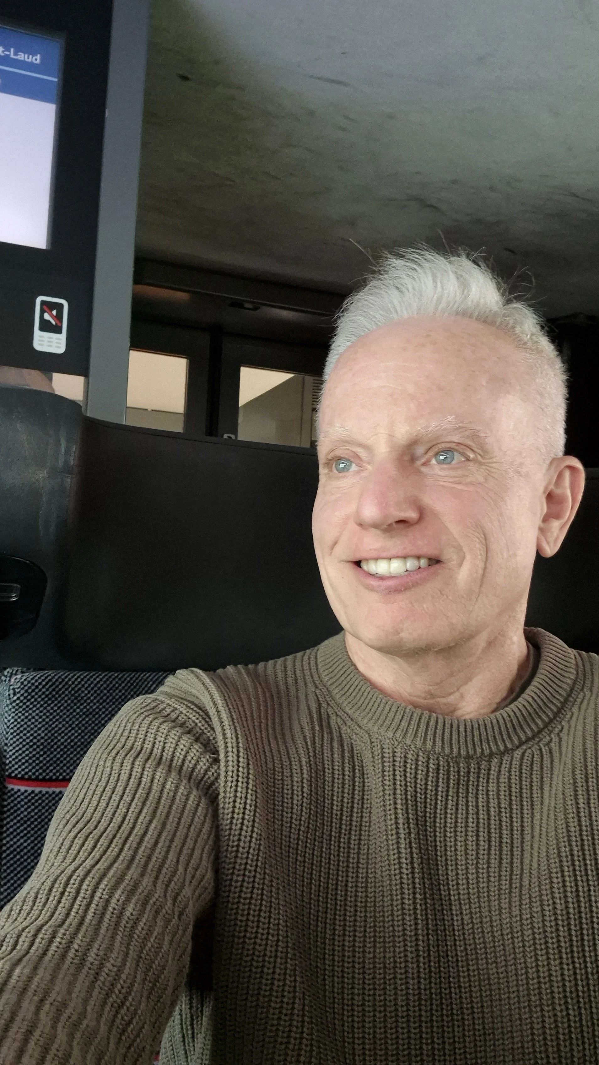 Michael, The Zen Guy, smiling on a French train — scouting-trip planning across cities