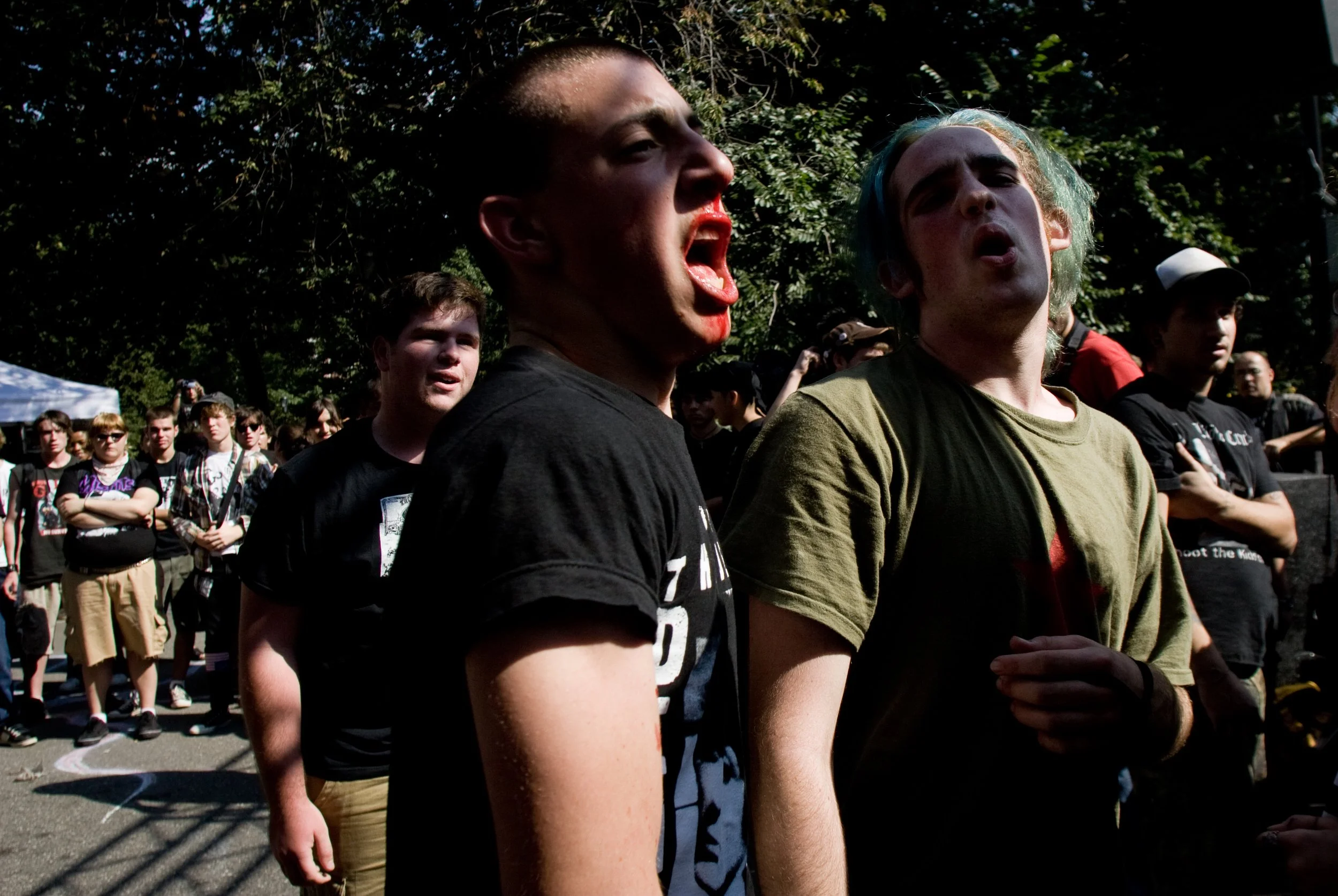 Just another Sunday in Thompkins Square park in New York City, as an impromtu concert kicks off a mosh pit.