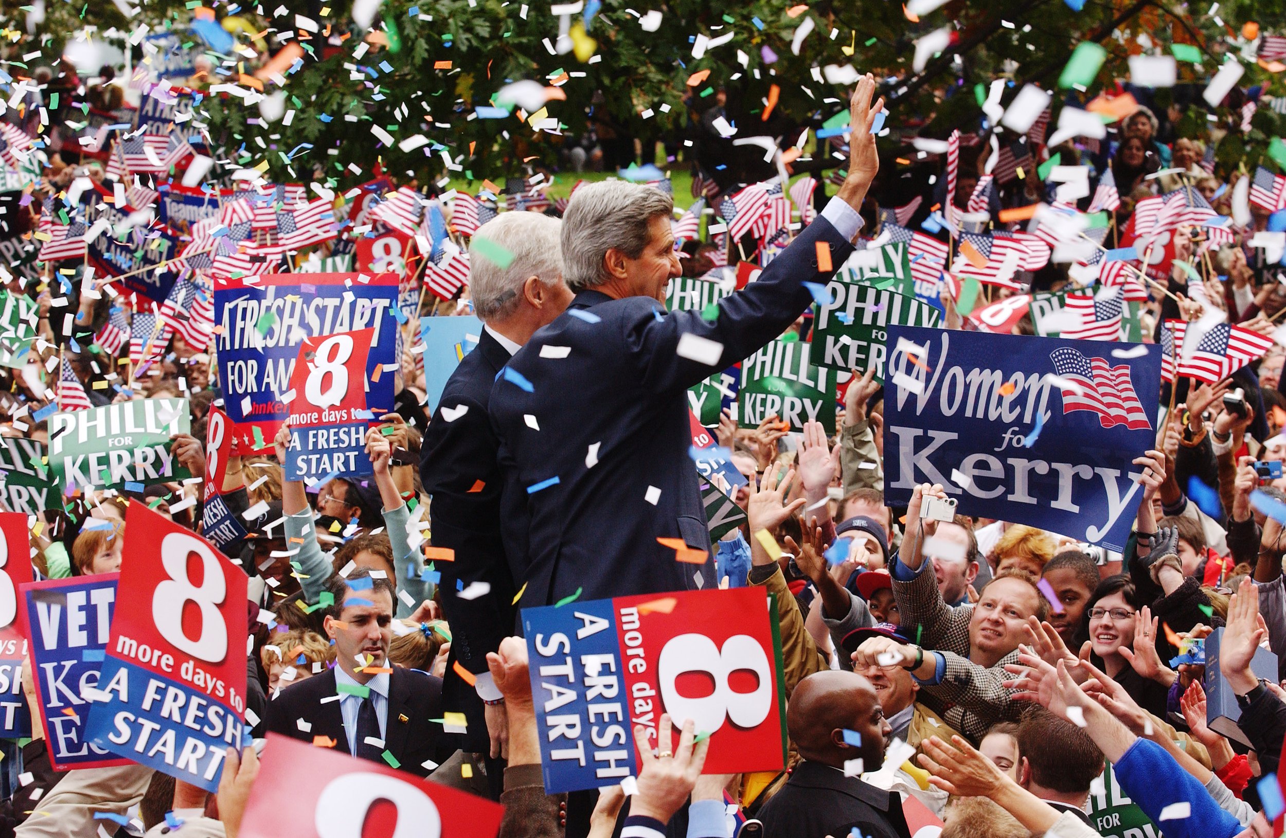 Former President Bill Clinton and Sen. John Kerry wave to the crowd during a campaign stop in Philadelphia, PA.