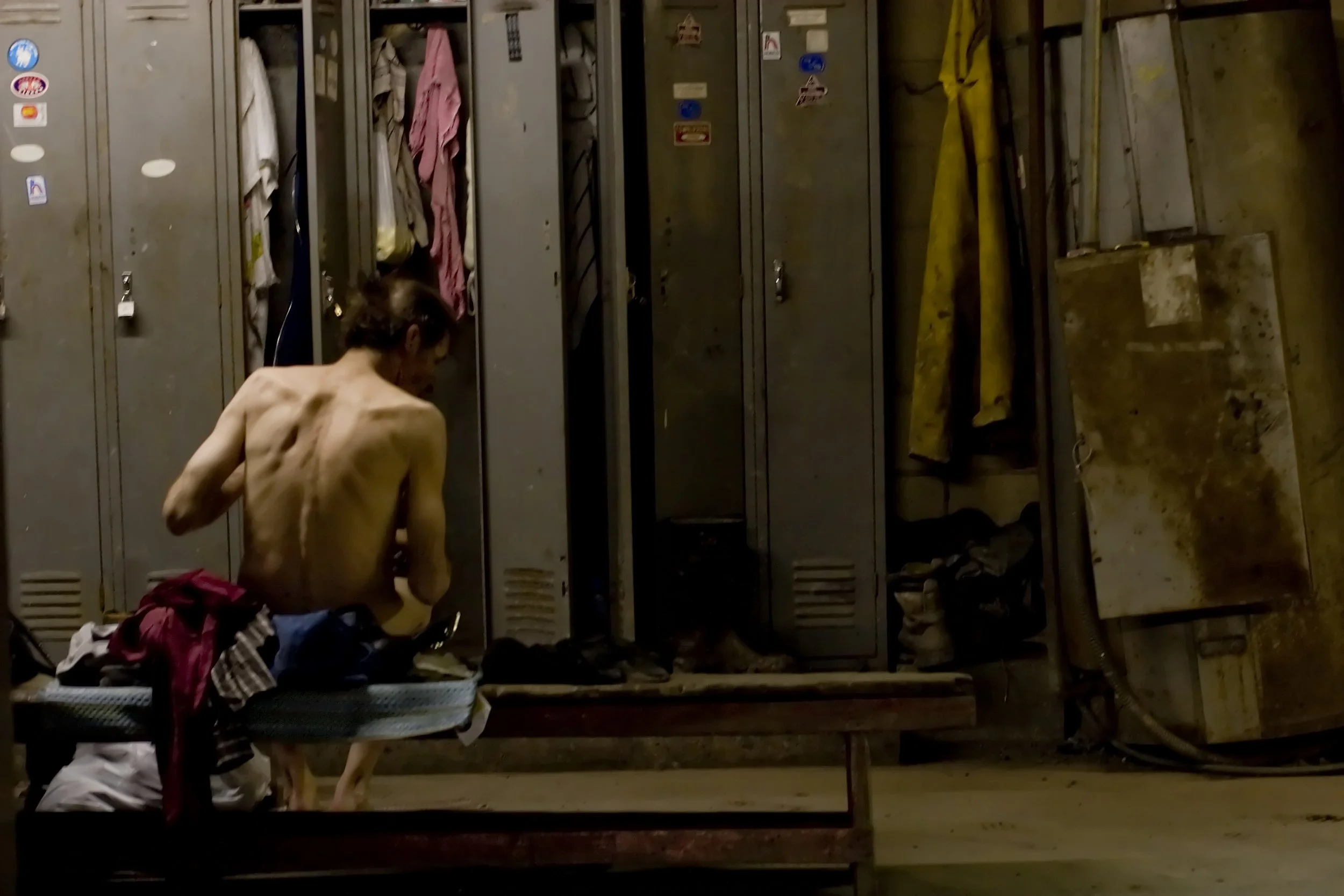 In one of the last remaining coal mines in Morgan County, Alabama, an aging miner changes out of his close after finishing his shift.