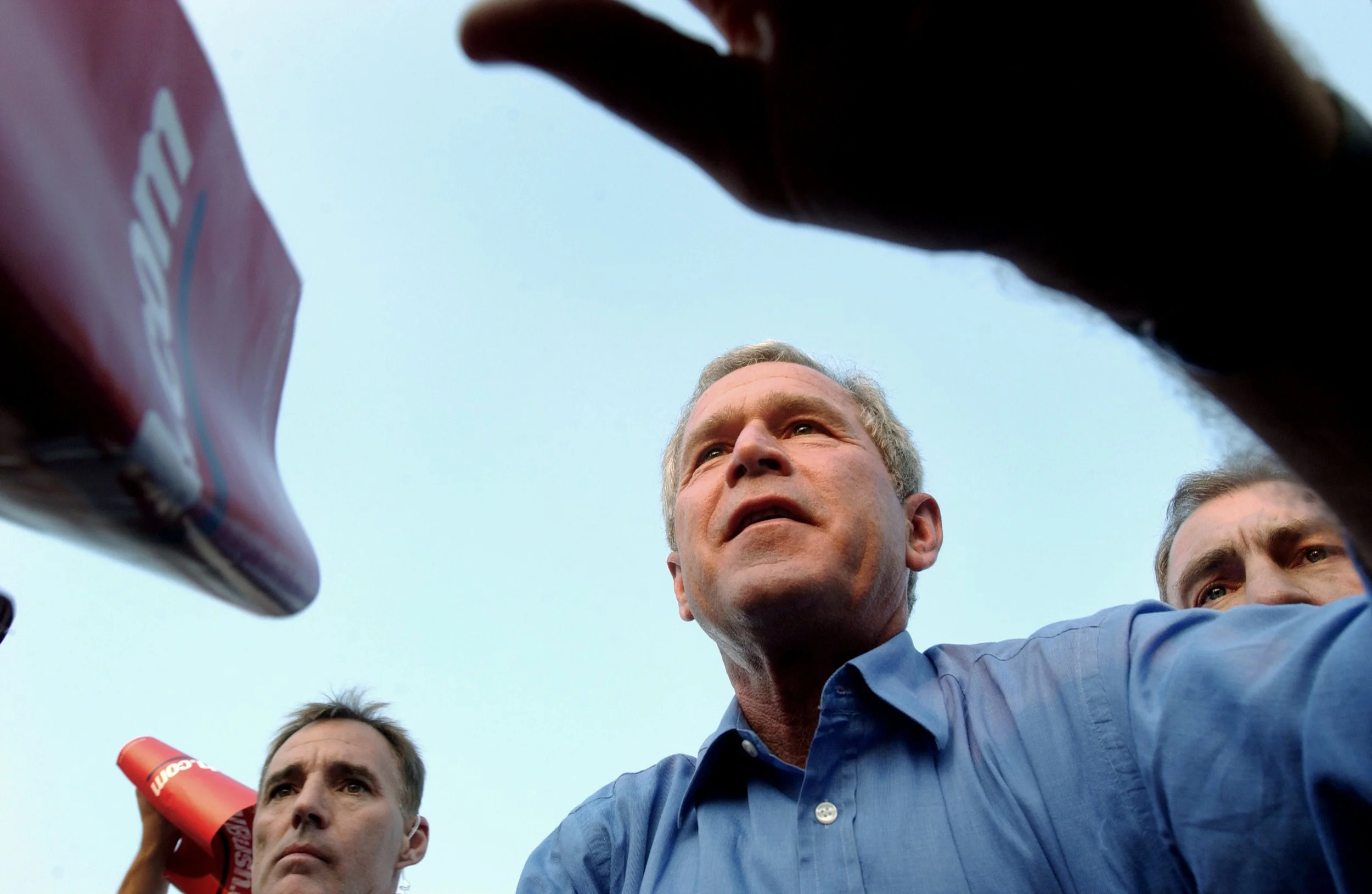 President George W. Bush reaches out to shake hands and greet supporters at a campaign rally in Northern Virginia.