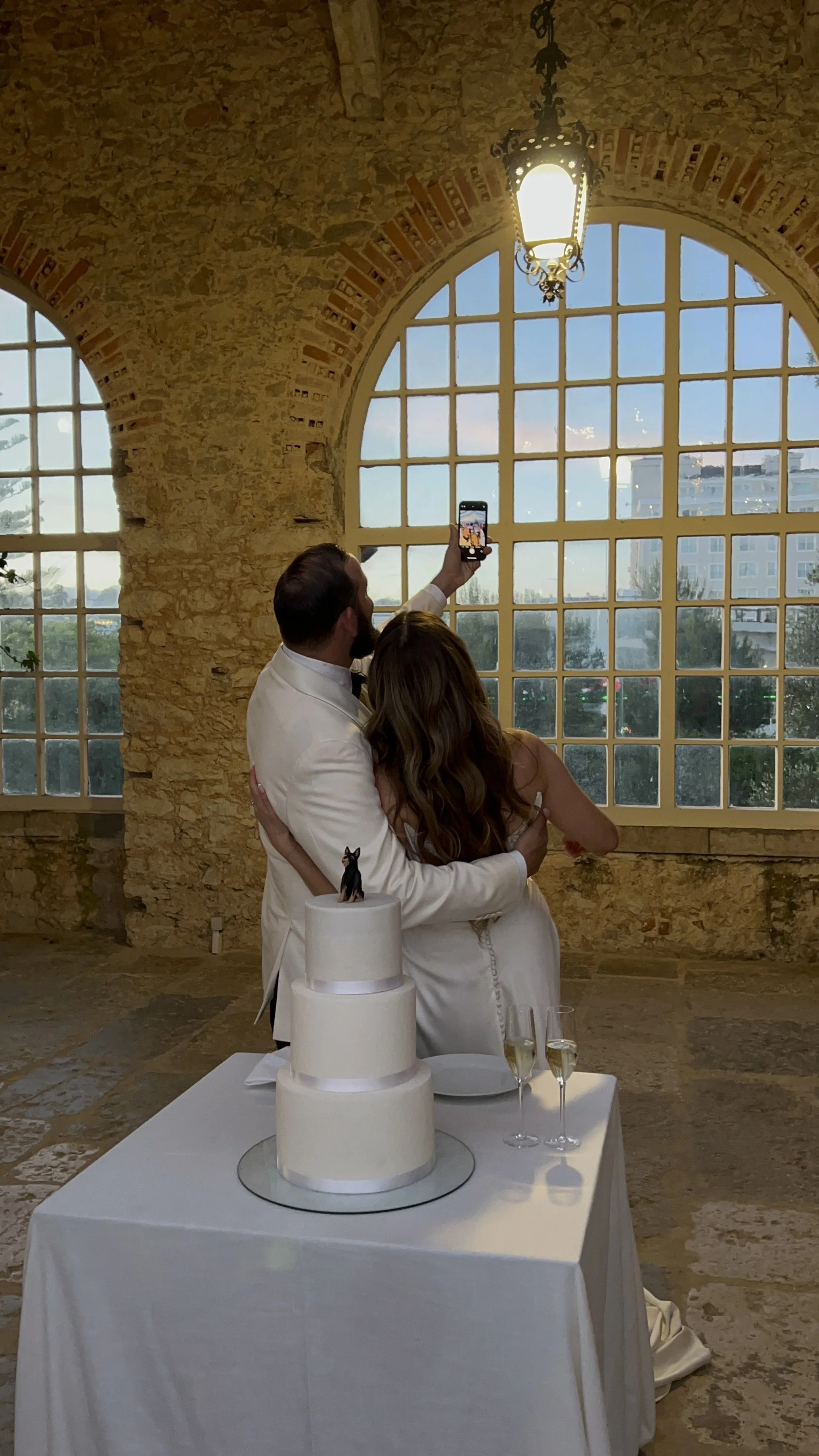 Wedding cake cutting moment captured at Portuguese palace destination wedding