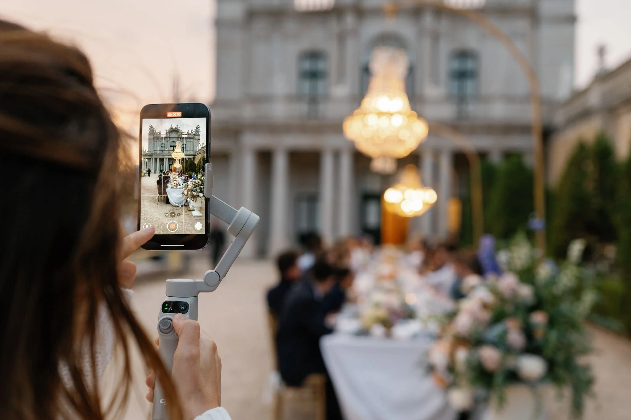 Professional wedding content creator working at European palace wedding