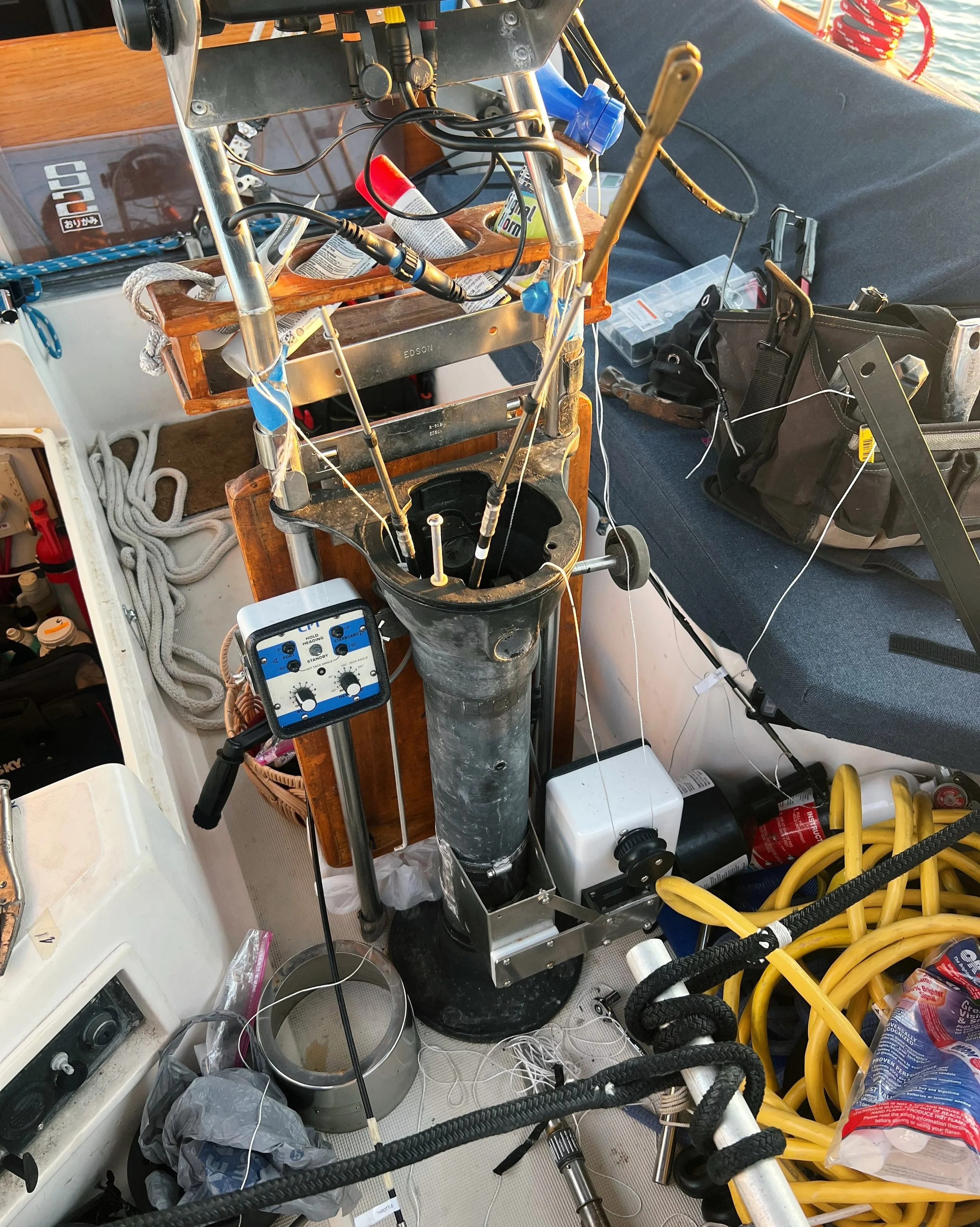 Day 53 &bull; A return to our New Bern days where we tear everything apart because the boat required yet another shipment of expensive stuff. This evening we replaced both the throttle and shift cables. We also ran wiring for the compass light. Finge