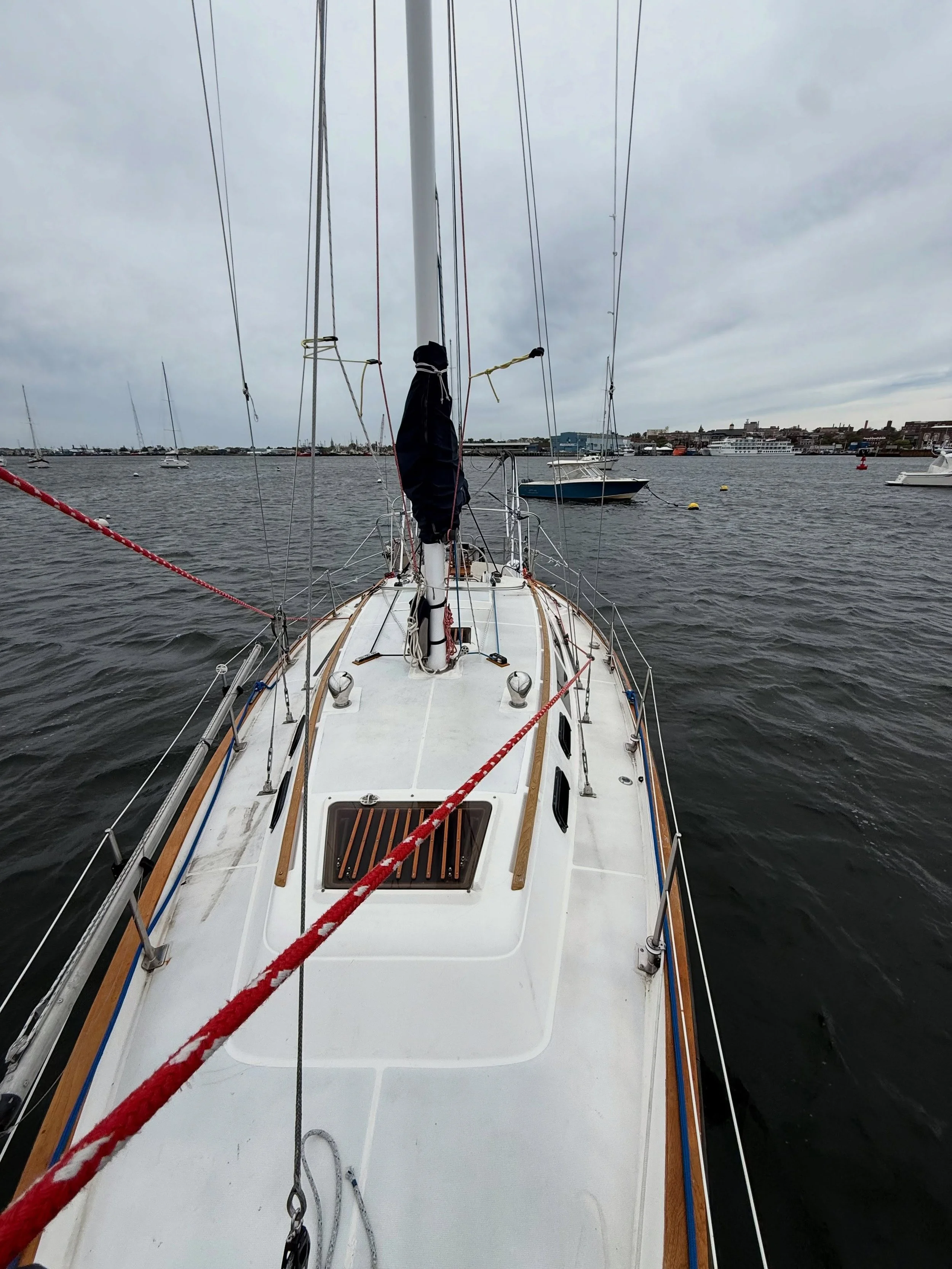 Day 125 &bull; It has started to rain off and on. The winds are picking up slightly, but nothing crazy yet. We did end up taking both the bimini and dodger down for peace of mind. Otherwise, we spent the evening resting, watching movies, and enjoying