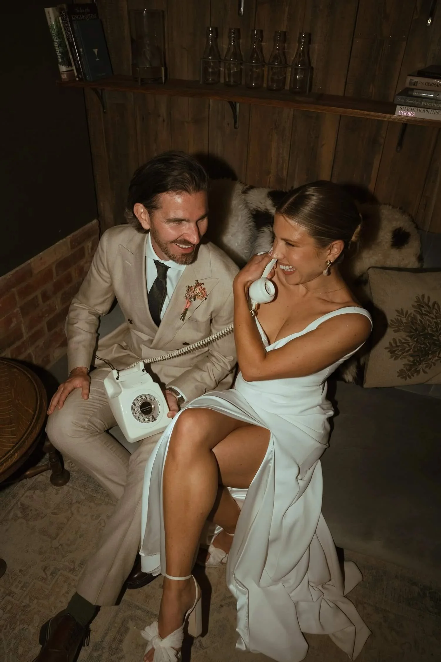 Couple leaving a voice message on a telephone audio guestbook at their wedding