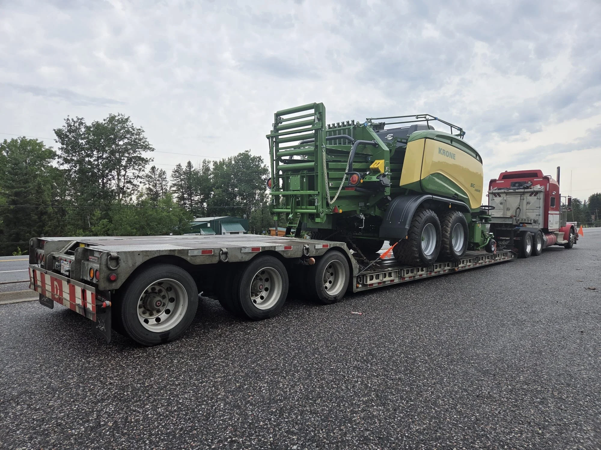 Krone bailer on his way to Alberta