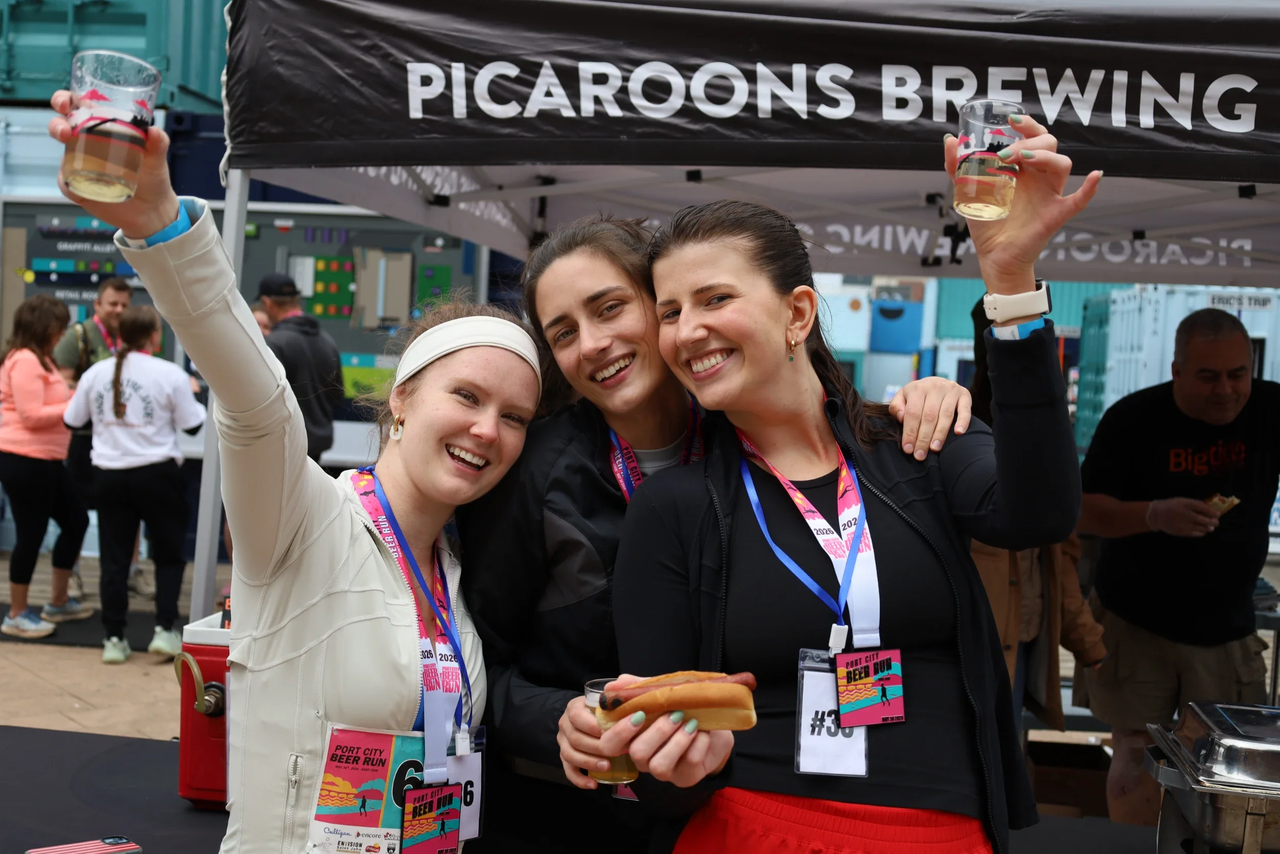 Port City Beer Run participants celebrating and toasting