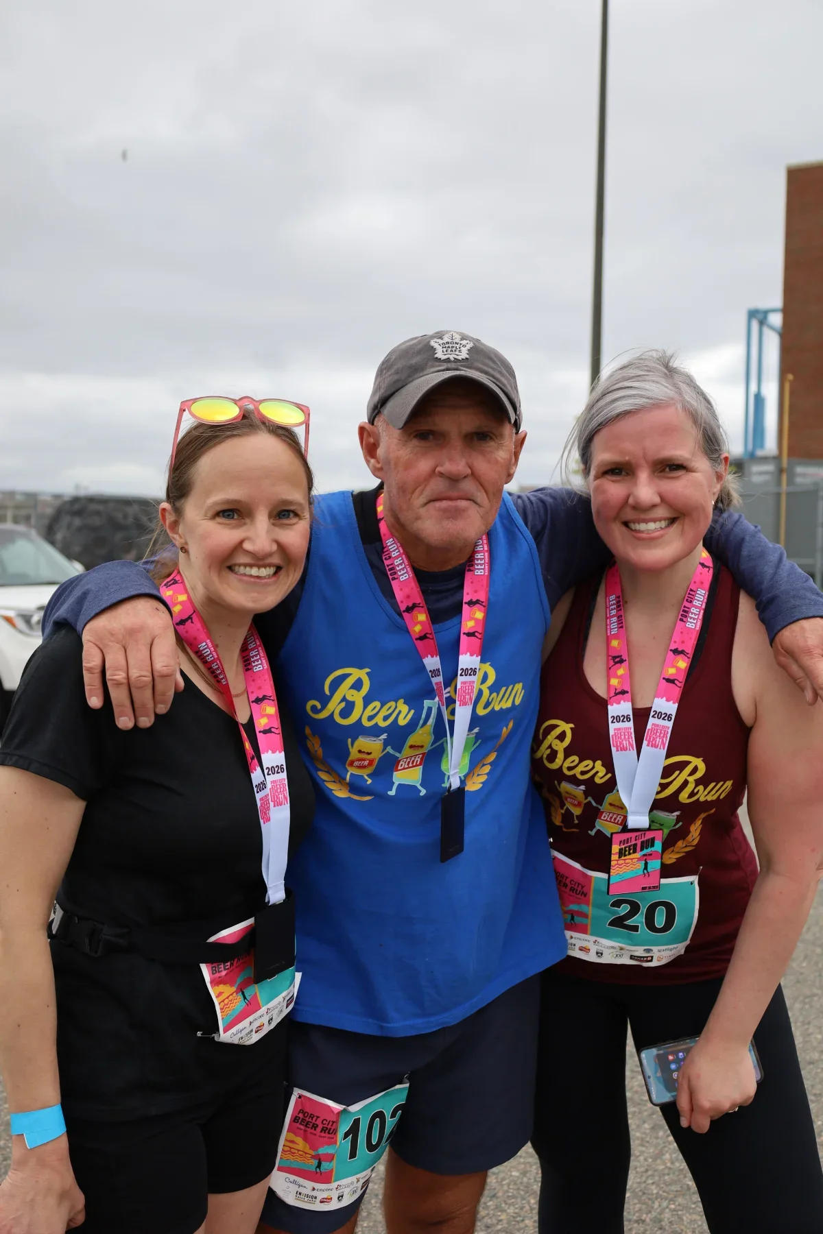 Three runners posing after the run