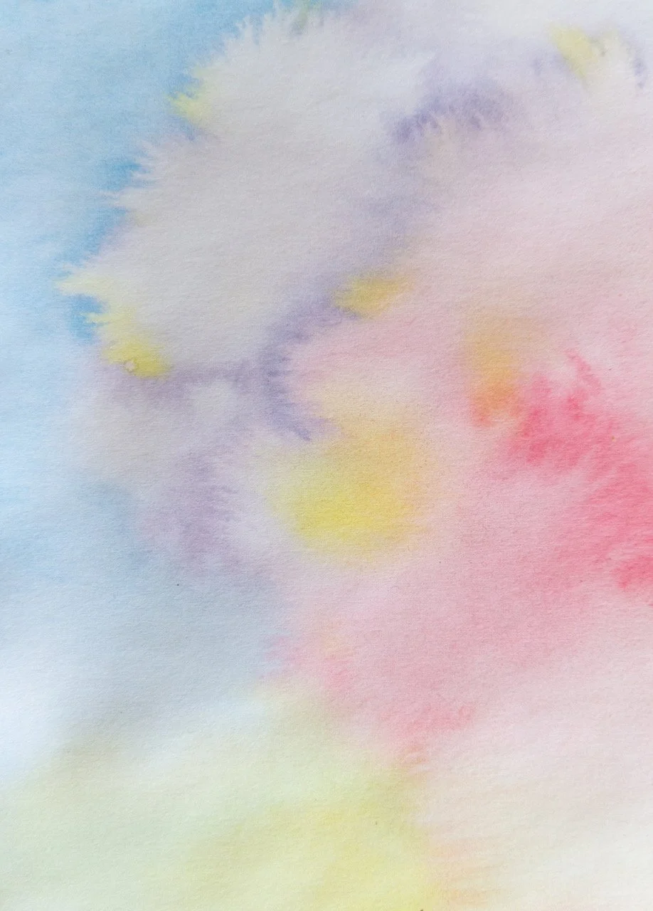 Bild mit dem Text 'BILD FOLGT' auf einem pastellfarbenen Hintergrund in Rosa, Gelb und Blau.