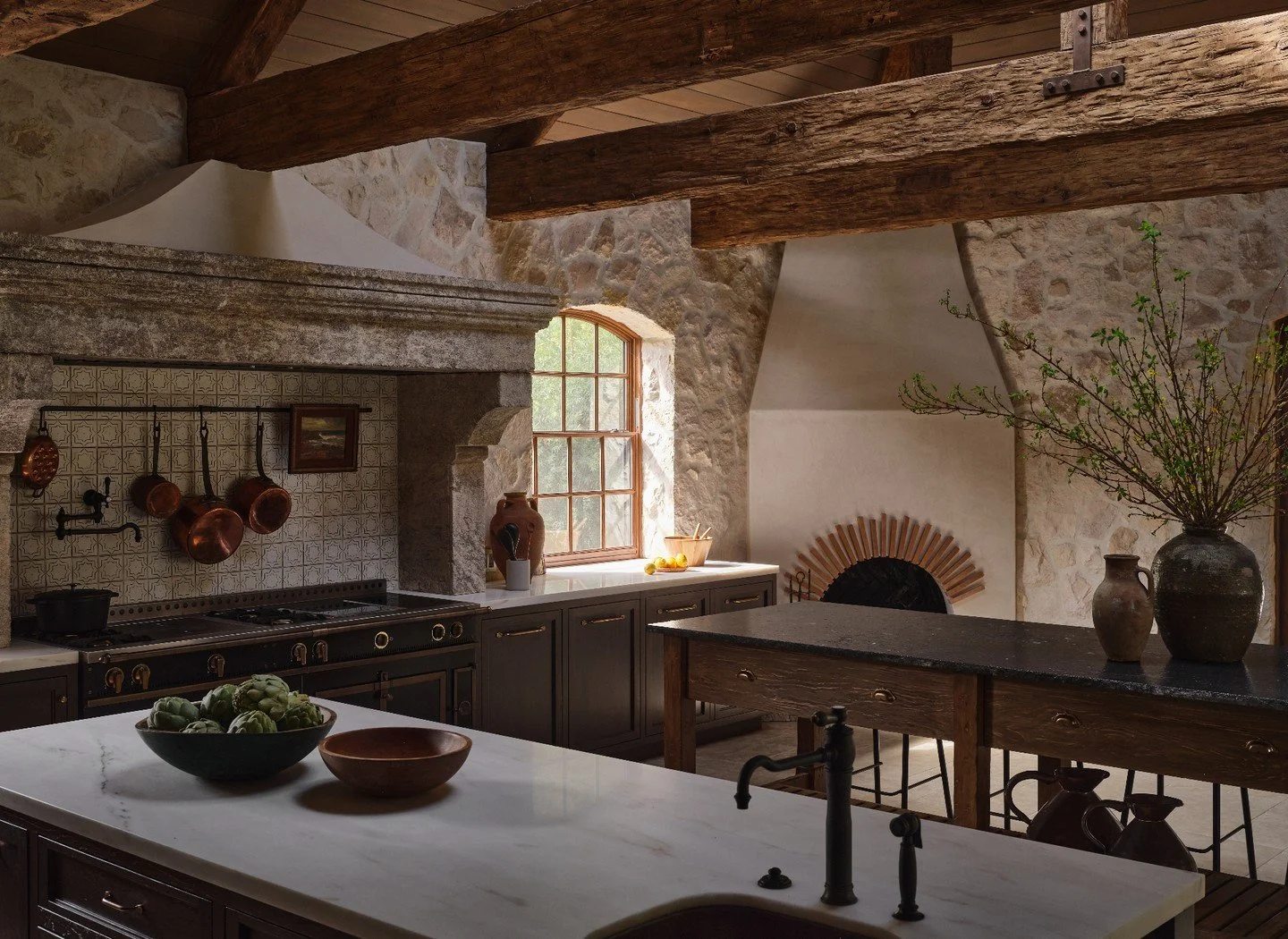 Entertaining is easy around a bespoke antique inspired island. Swipe to see initial concept sketches &amp; styling behind the scenes during photoshoot. Details include hand carved and antiqued legs, chiseled stone countertop, ample storage and slatte