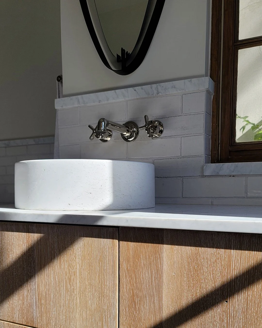 Sneak preview into a Guest Bathroom we designed for our Benedict Canyon Residence with nothing short of the the most beautiful stone &amp; tile details, a vintage mirror, and bespoke cerused oak cabinets.
#RiccioVidaurreDesign

Photo @RiccioVidaurre
