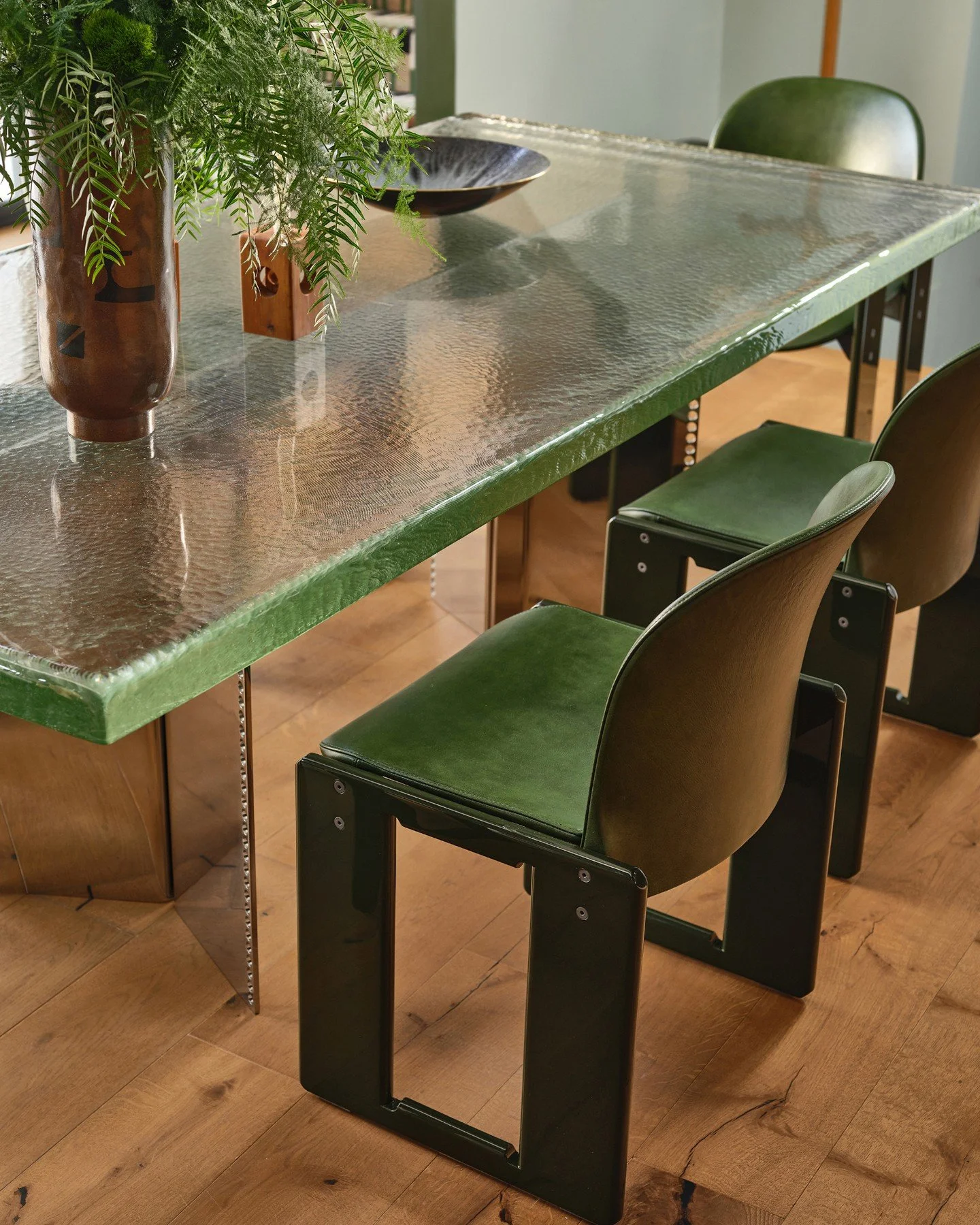 Previously, the kitchen was interrupted by a small floating island that fragmented the space and left little room for a proper dining area. In its place, the striking &ldquo;Four Man Punch&rdquo; Dining Table by EJR Barnes now anchors the room, its s
