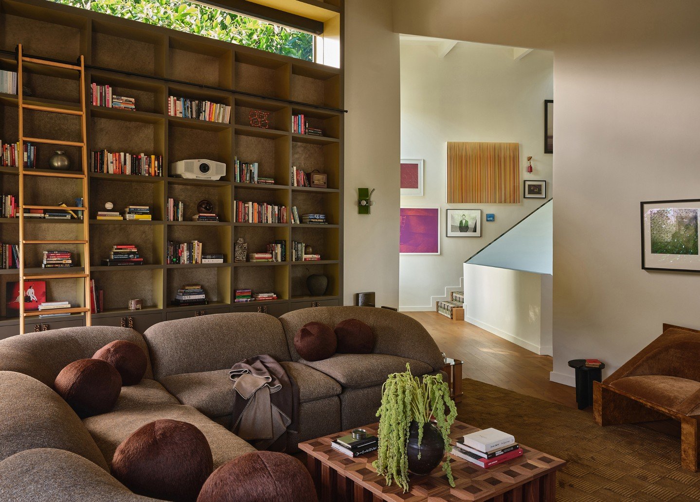 In the gallery-like living room, a striking photography by Nadia Lee Cohen draws you in, its cinematic edge playing against a commissioned abstract painting from a close friend that hangs above the newly refinished fireplace. 

Design: Riccio Vidaurr