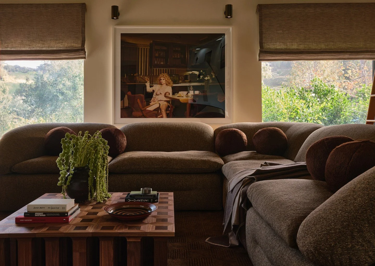 Anchoring the seating area the newly debuted &ldquo;Butter Sofa&rdquo; by Faye Toogood is set atop the &ldquo;Tesselation&rdquo; rug by Texturehaus.  The sculptural &ldquo;Arcus Coffee Table by Tim Vranken&mdash;with its beautiful trompe-l'oeil top&m