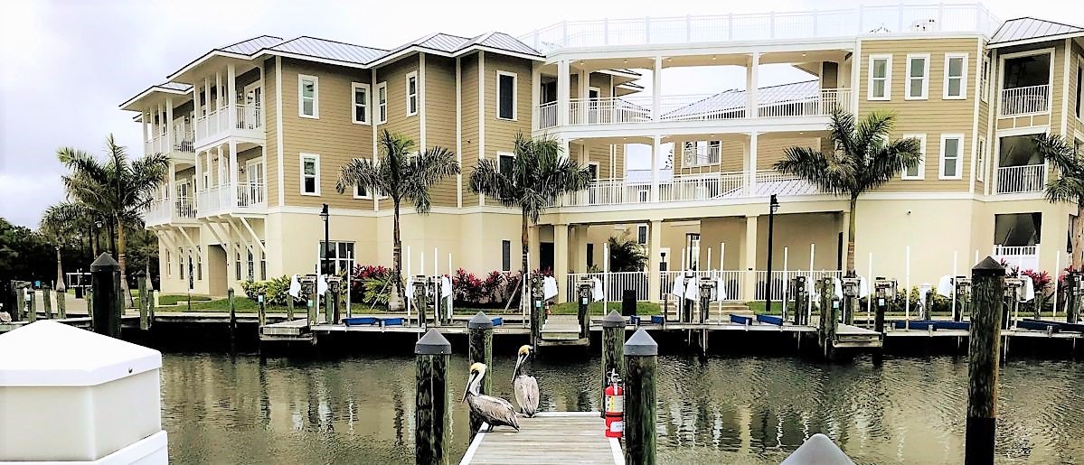 Waterline-Marina-Resort-Exterior-with-Pelicans-e1552406301161.jpg