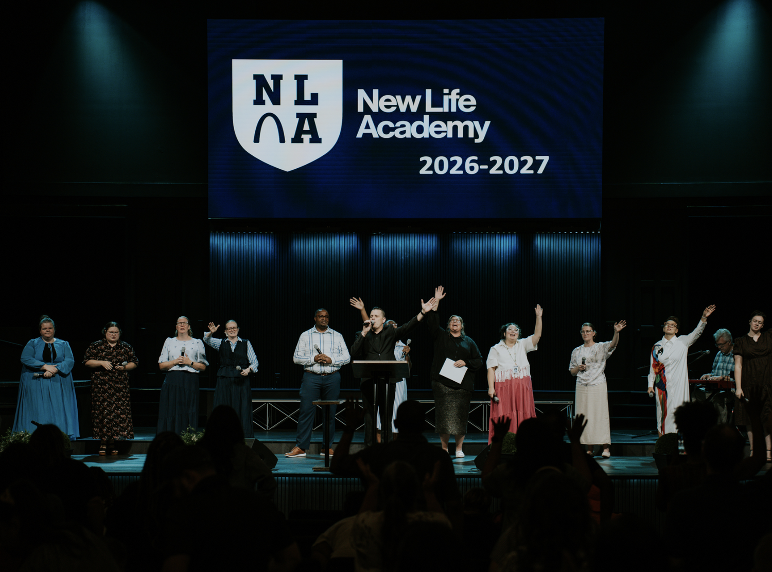 Chapel service with New Life Academy staff on stage