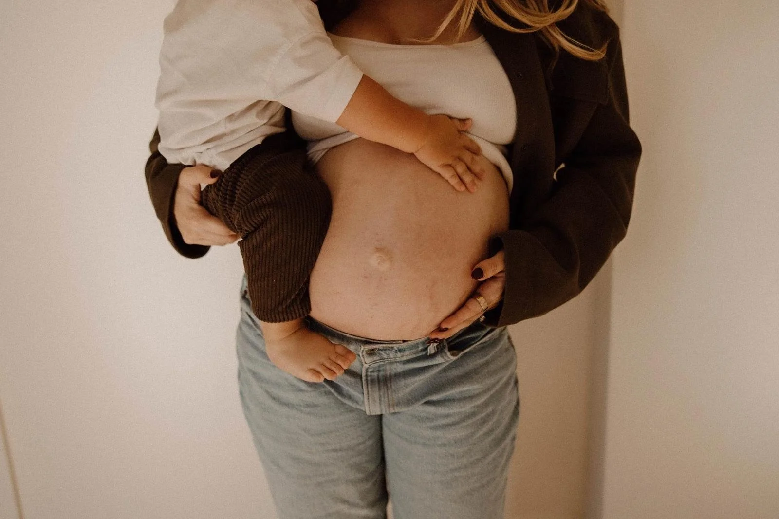 A close portrait of a mother and her baby together