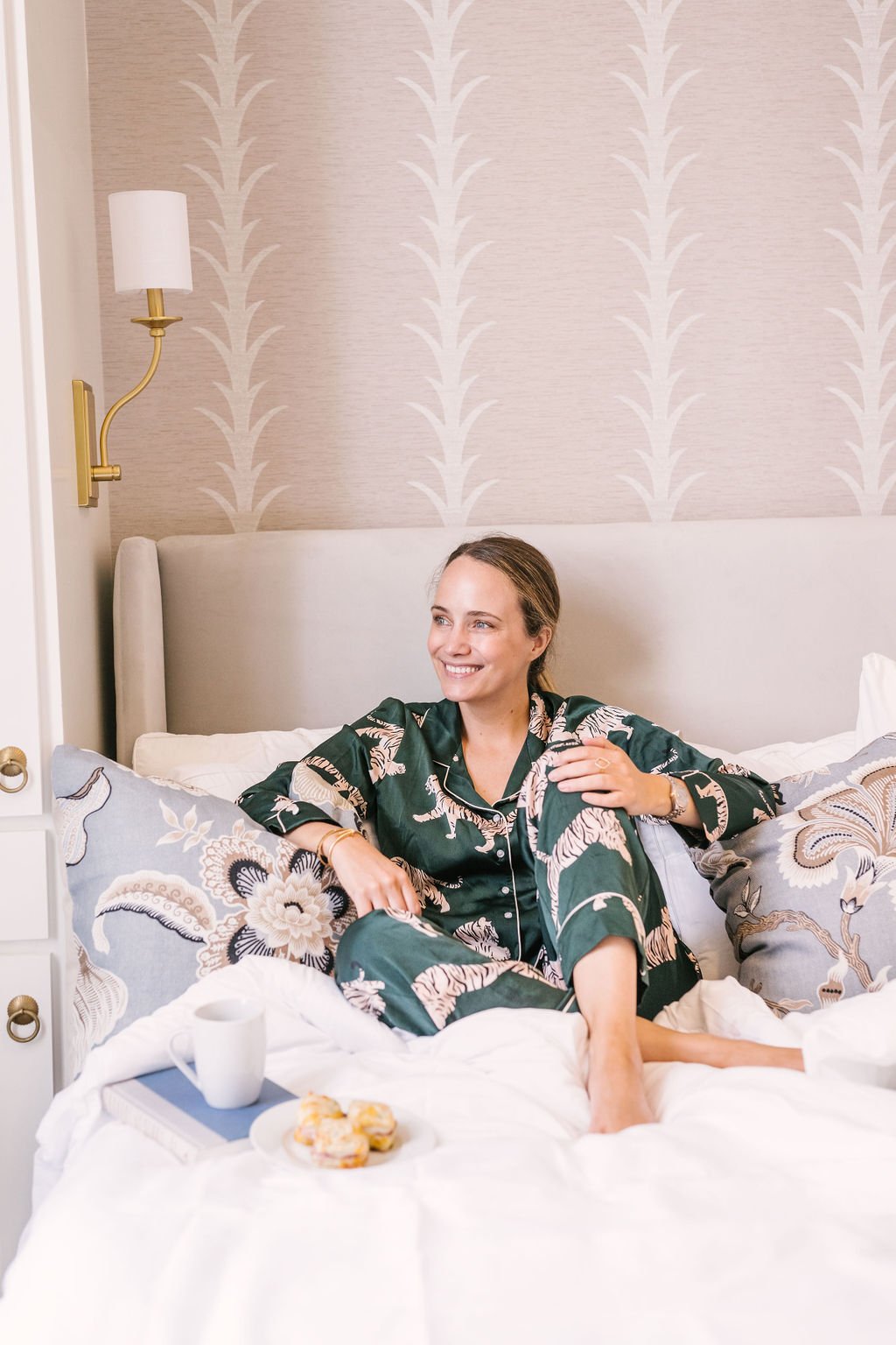 guest relaxing in king bedroom at luxury Charleston vacation rental