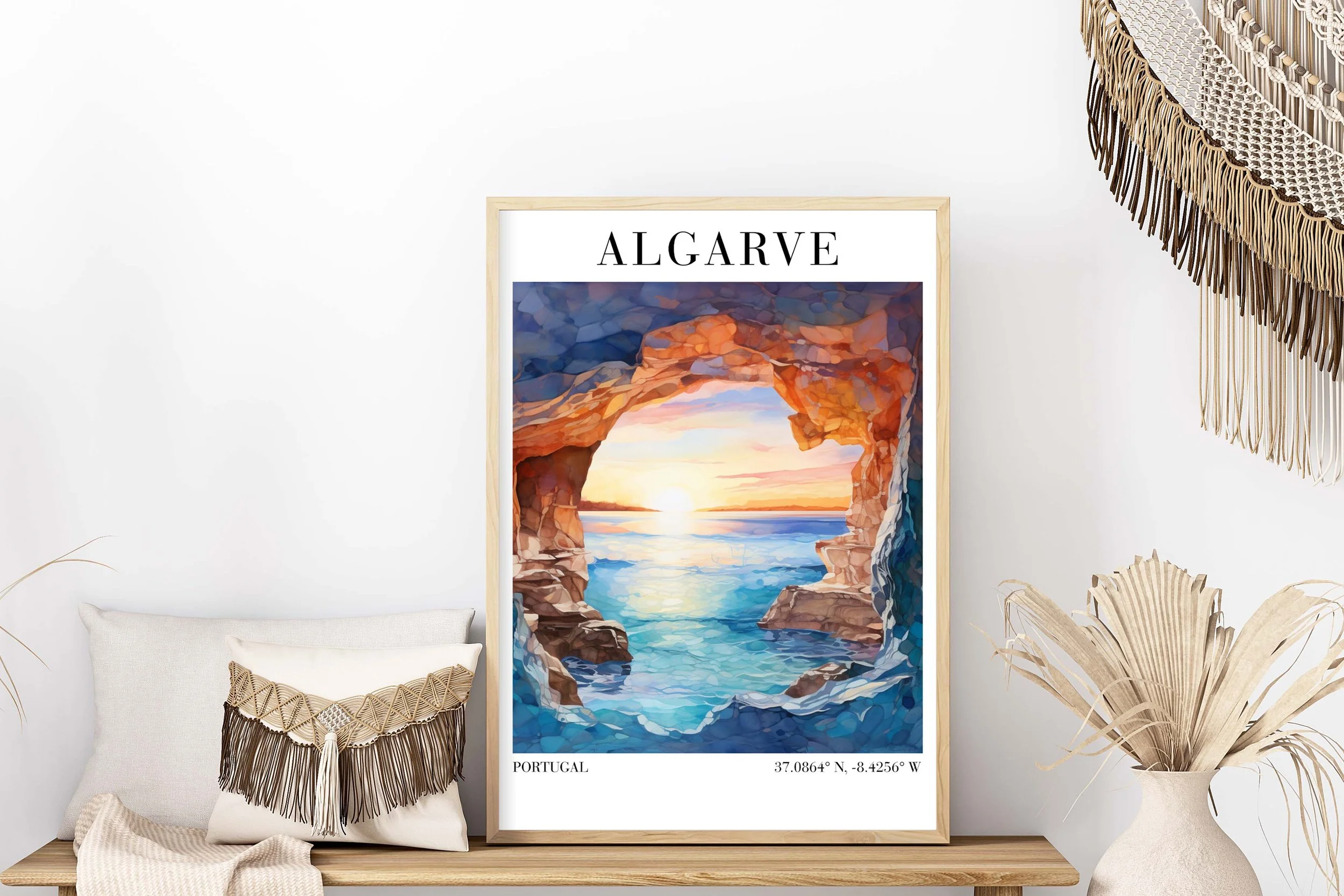 Poster of a scenic coastal view with a sunset, rocky cliffs framing the ocean, and the word "ALGARVE" at the top, with coordinates and country "Portugal" at the bottom.