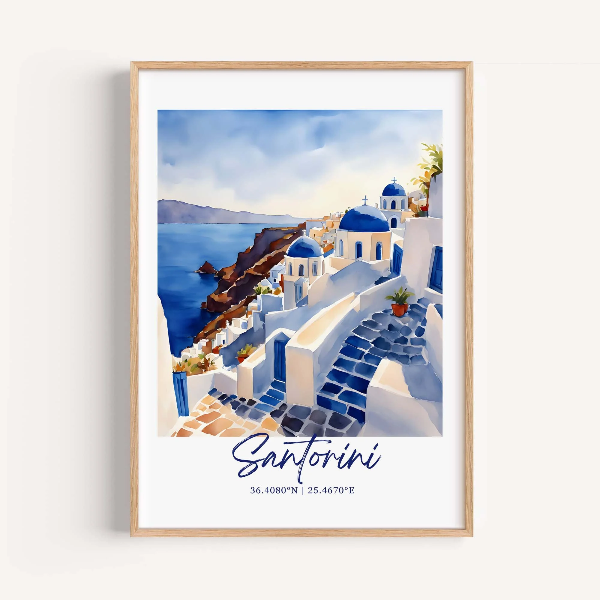 A framed watercolor painting of Santorini, Greece, featuring white buildings with blue domes and doors, stairs, potted plants, the sea, and a cloudy sky.