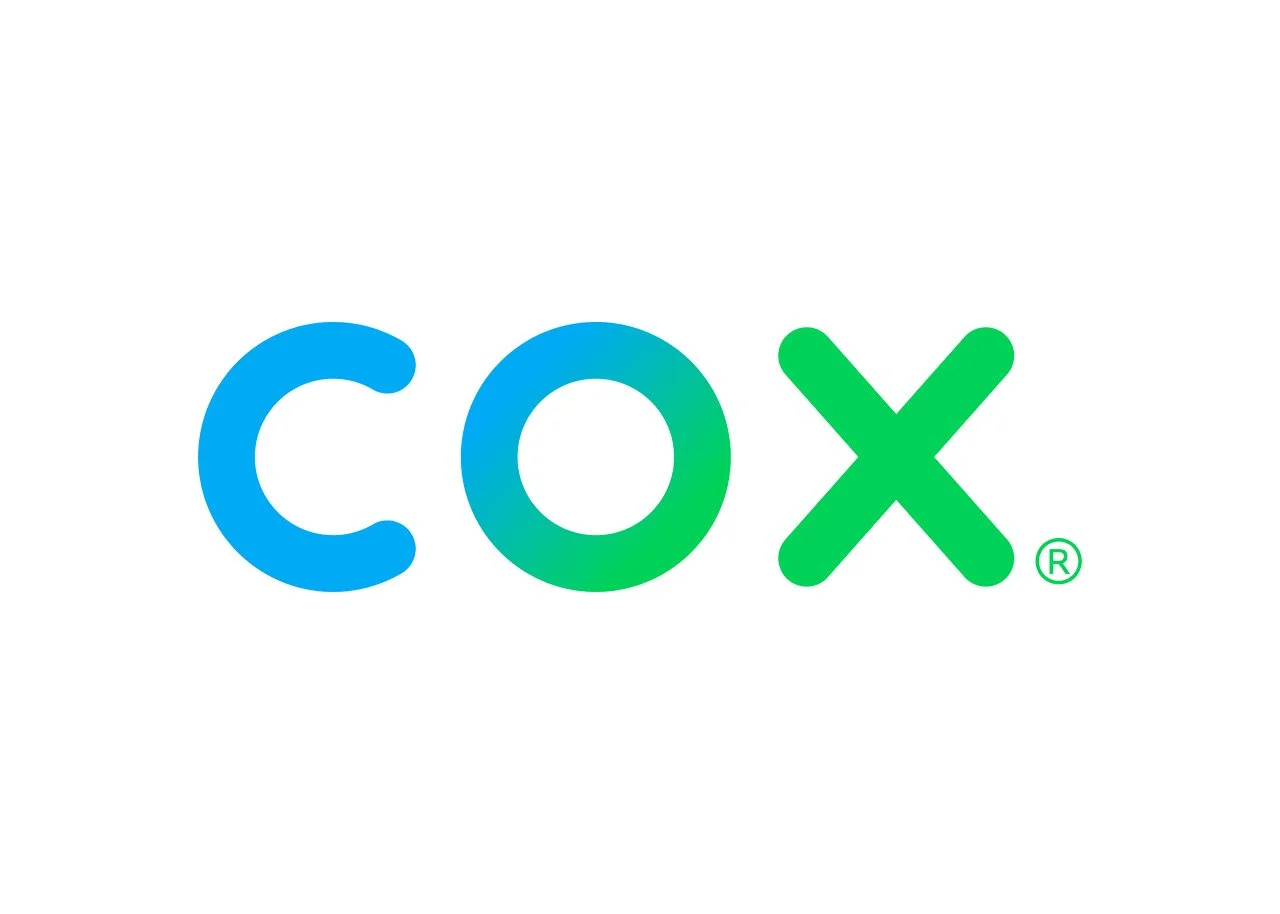 Colorful logo featuring the word 'COX' with the letters in shades of blue and green, and a registered trademark symbol.