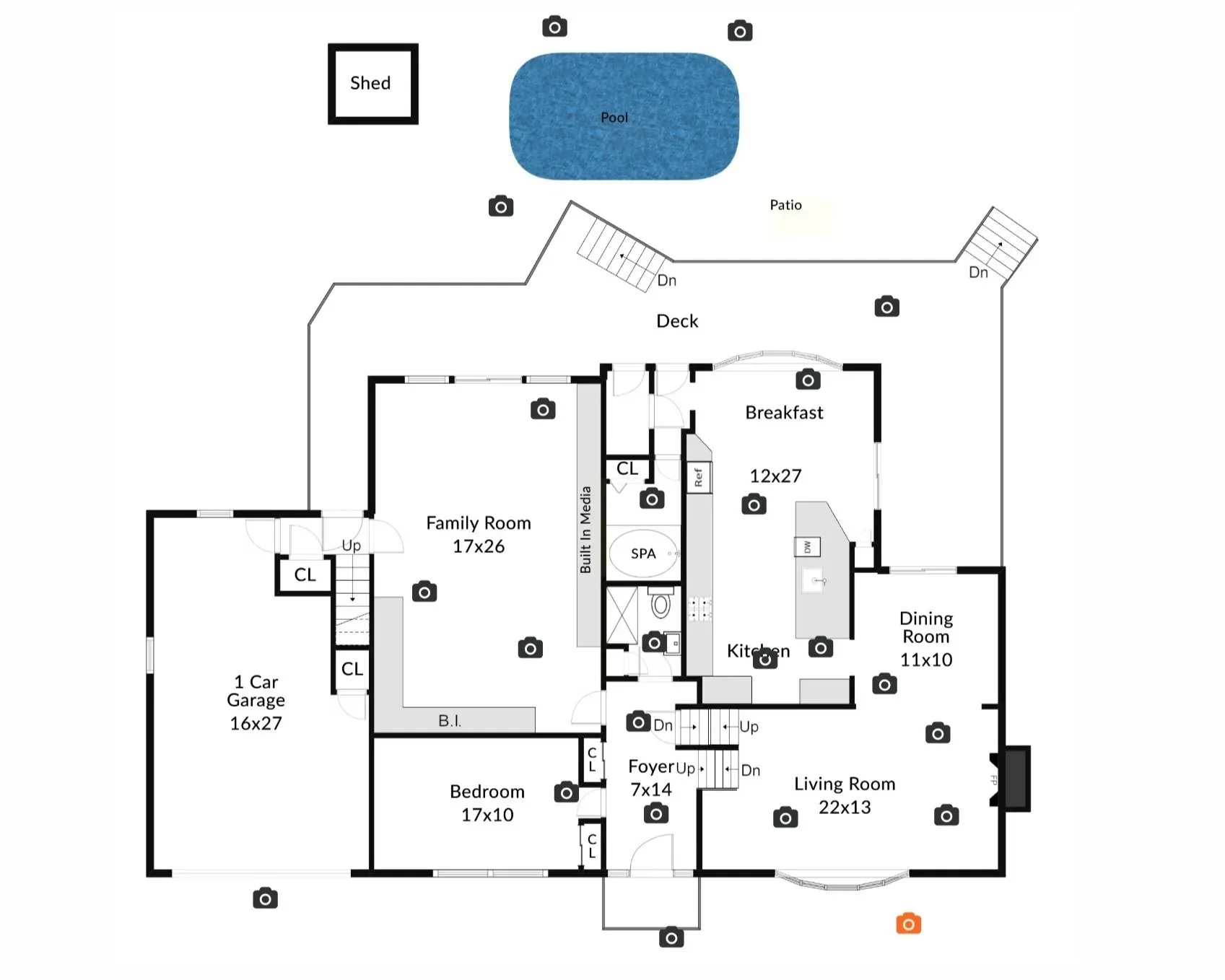 Floor plan of a house showing rooms, stairs, garage, deck, pool, patio, and a shed outside.