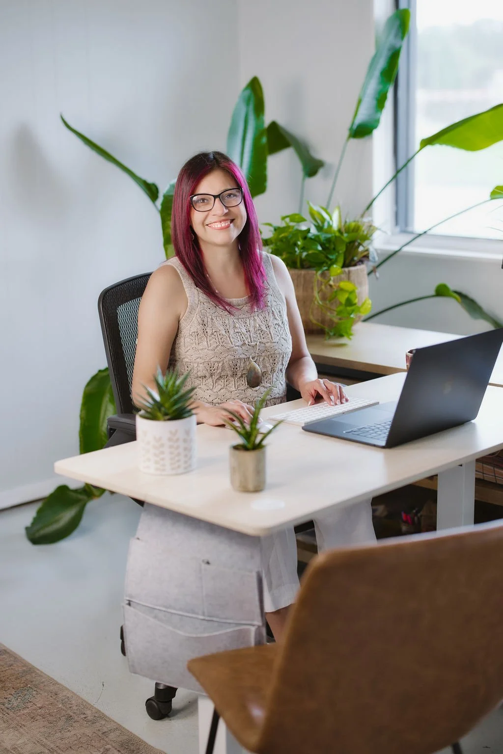 Bloom's web designer, Veronica Diaz, on desk