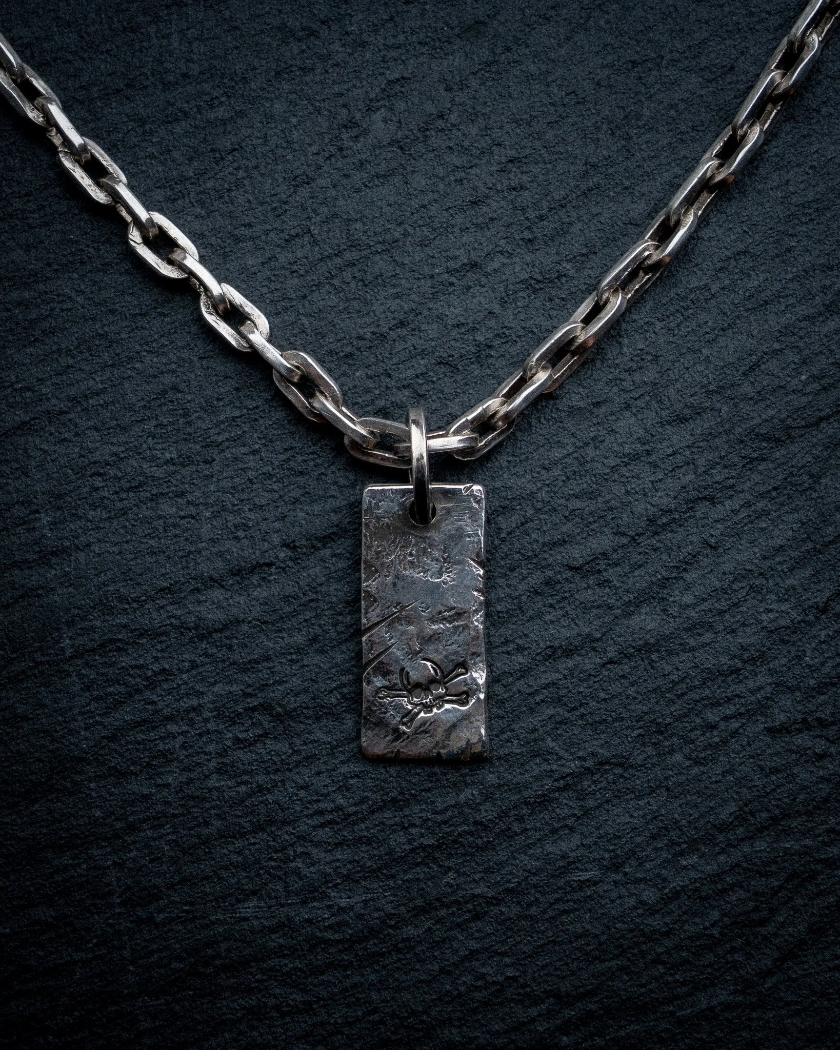 The Two Bits Pendant on the Galleon's Anchor Chain.