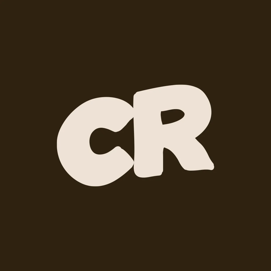 The image shows the word "CR" in large, beige, bold, stylized letters on a dark brown background.