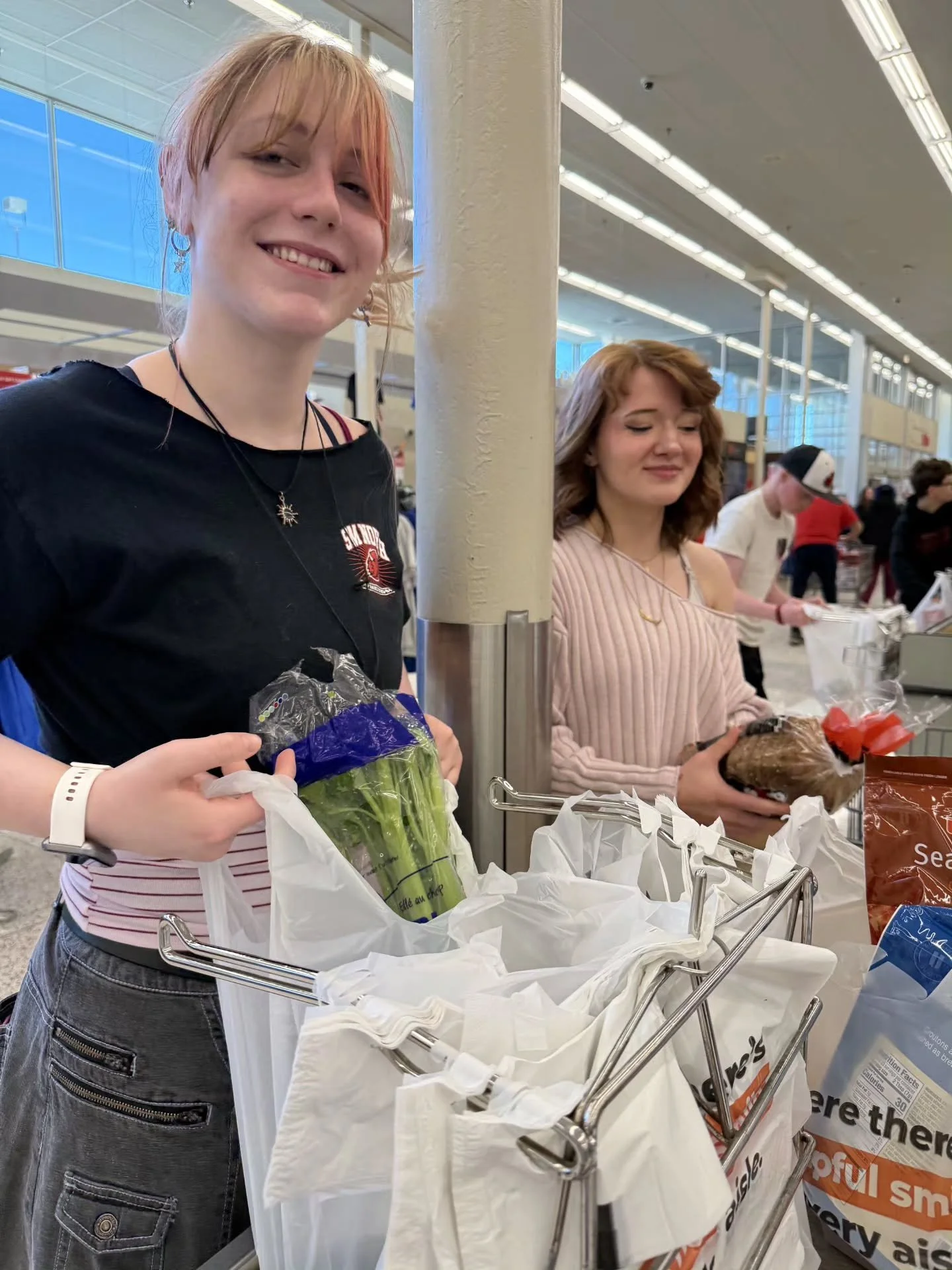 A few snapshots caught during our grocery sacking event.