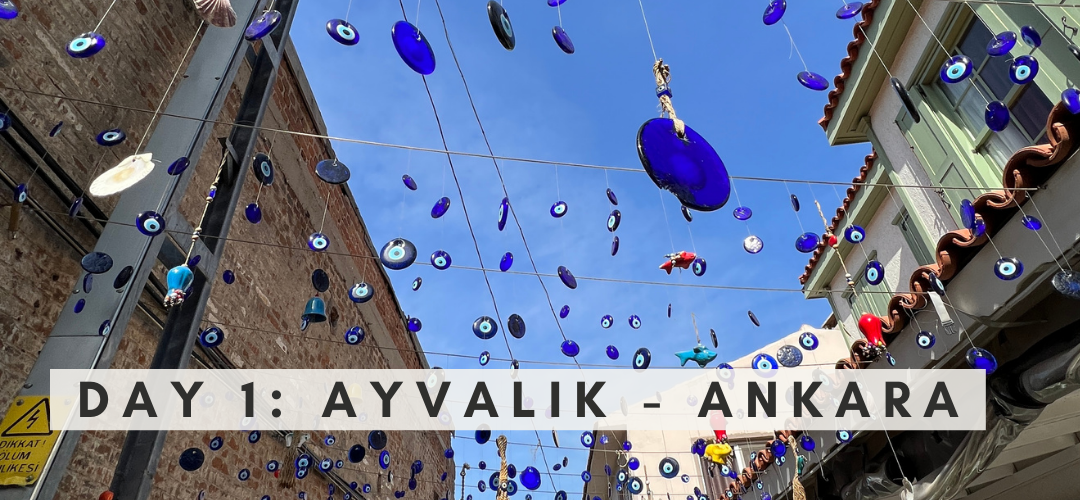 Glass evil eyes hang in alleyway in Ayvalik Turkiye