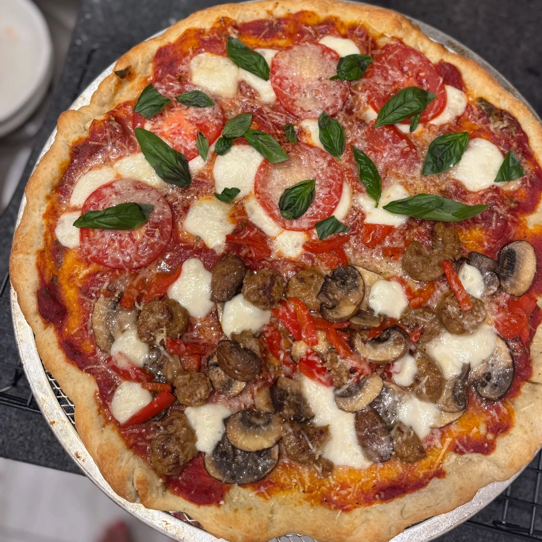 Pizza half margherita and half sausage