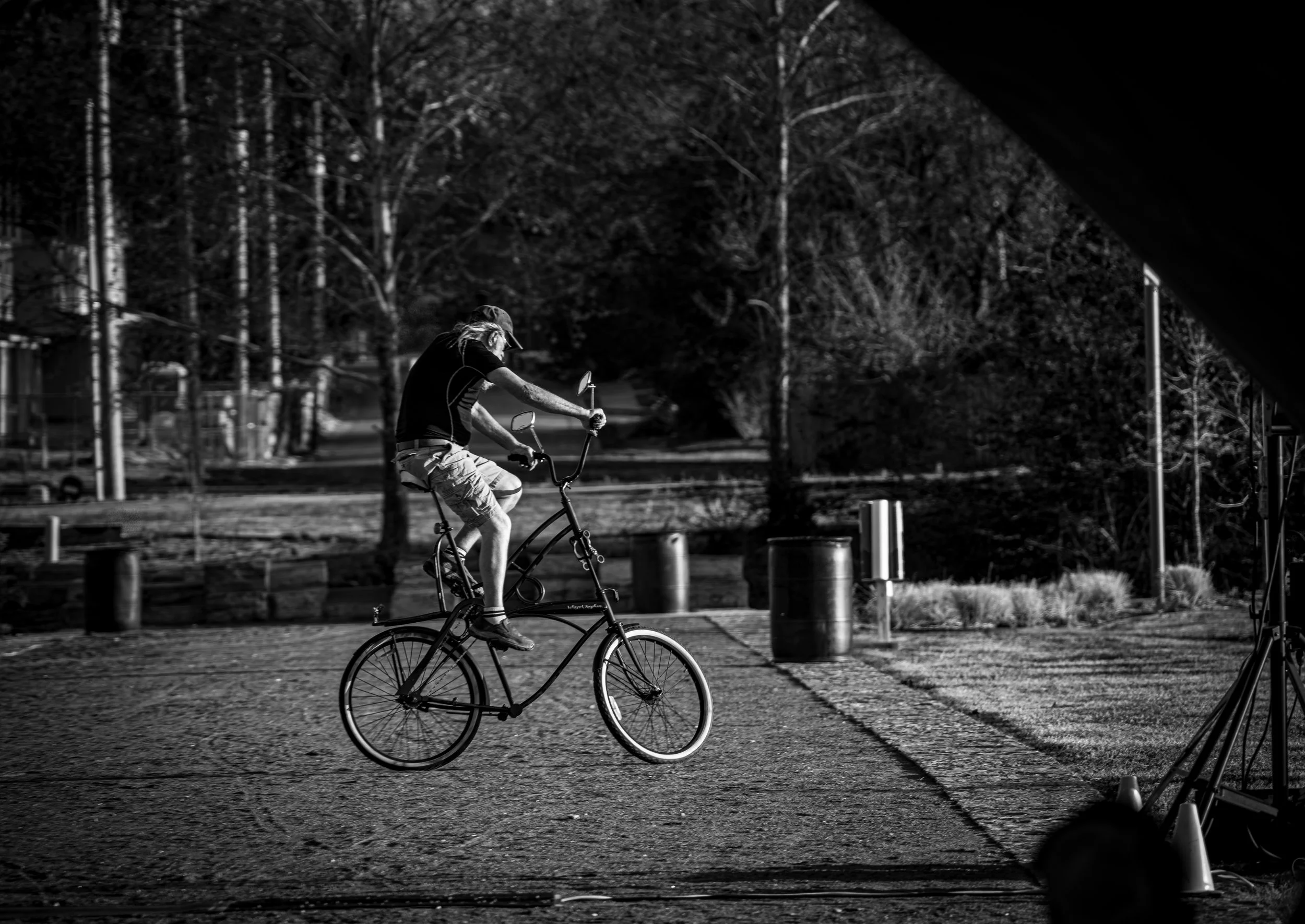 Man Riding a Tall Bike