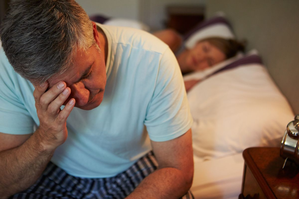 Man experiencing fatigue and brain fog symptoms of low NAD+ levels