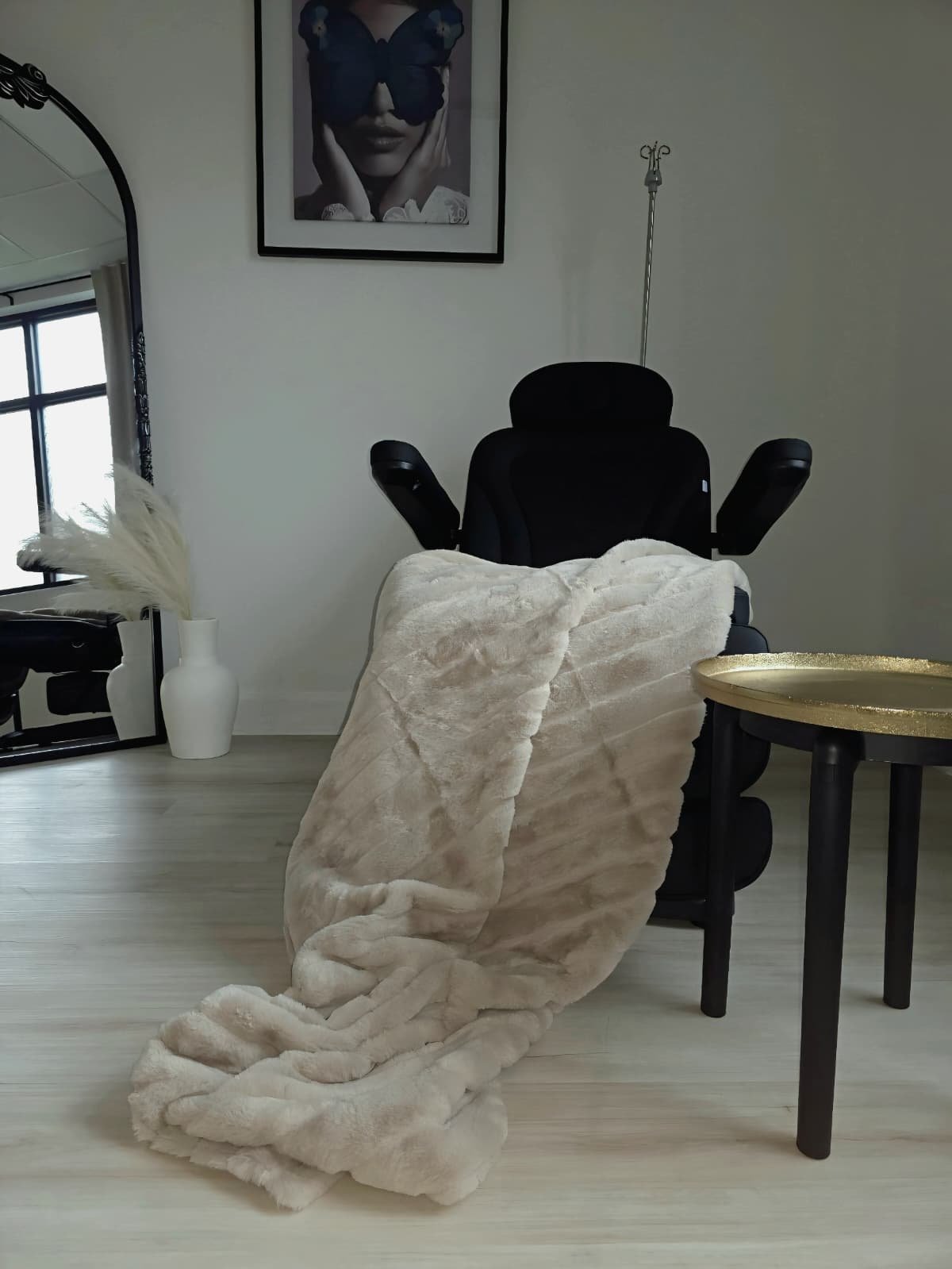 Luxury wellness treatment chair with plush blanket in a modern medical spa setting at GlowMD in Katy, TX