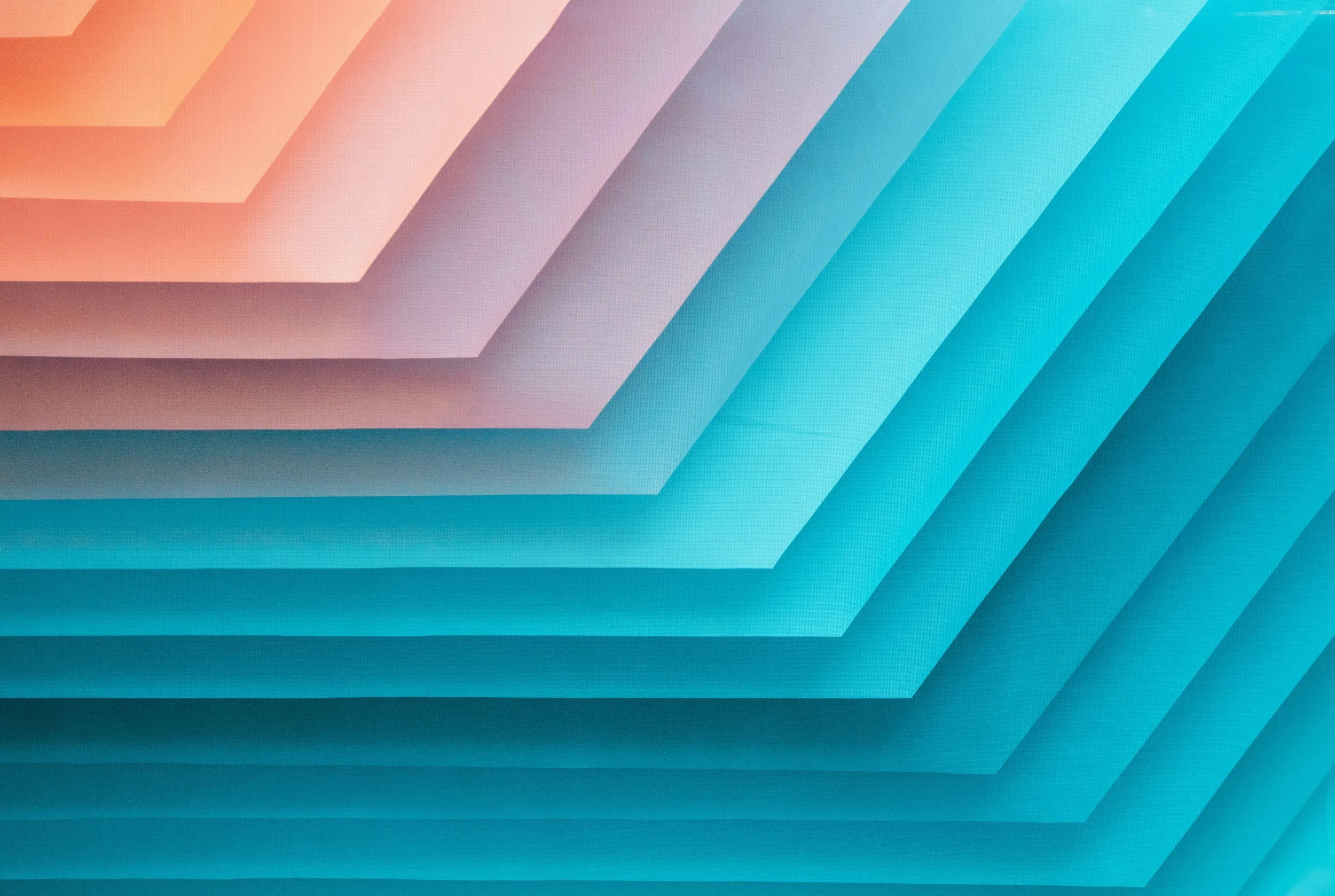 Abstract digital artwork with layered geometric shapes in shades of orange, pink, purple, and blue.