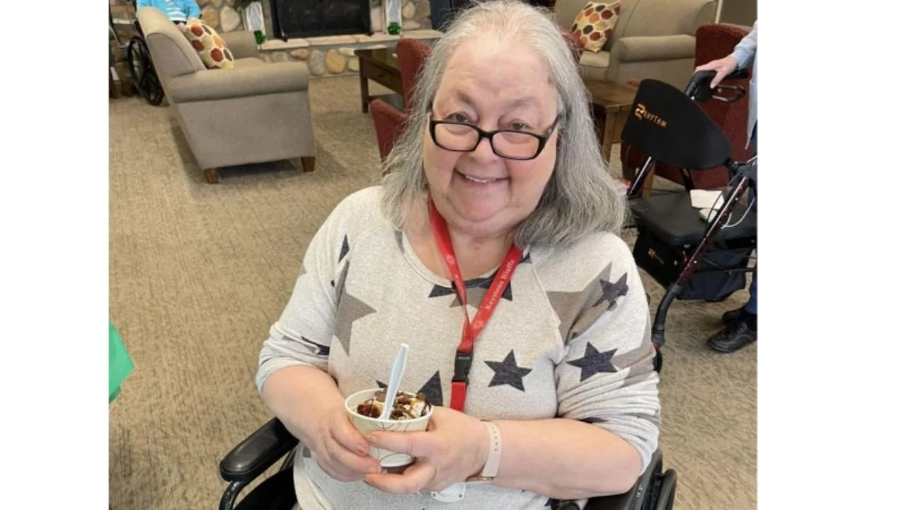Ageing lady sitting on chair 