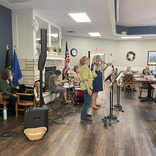 Seniors perform spring-themed music at assisted living community celebration