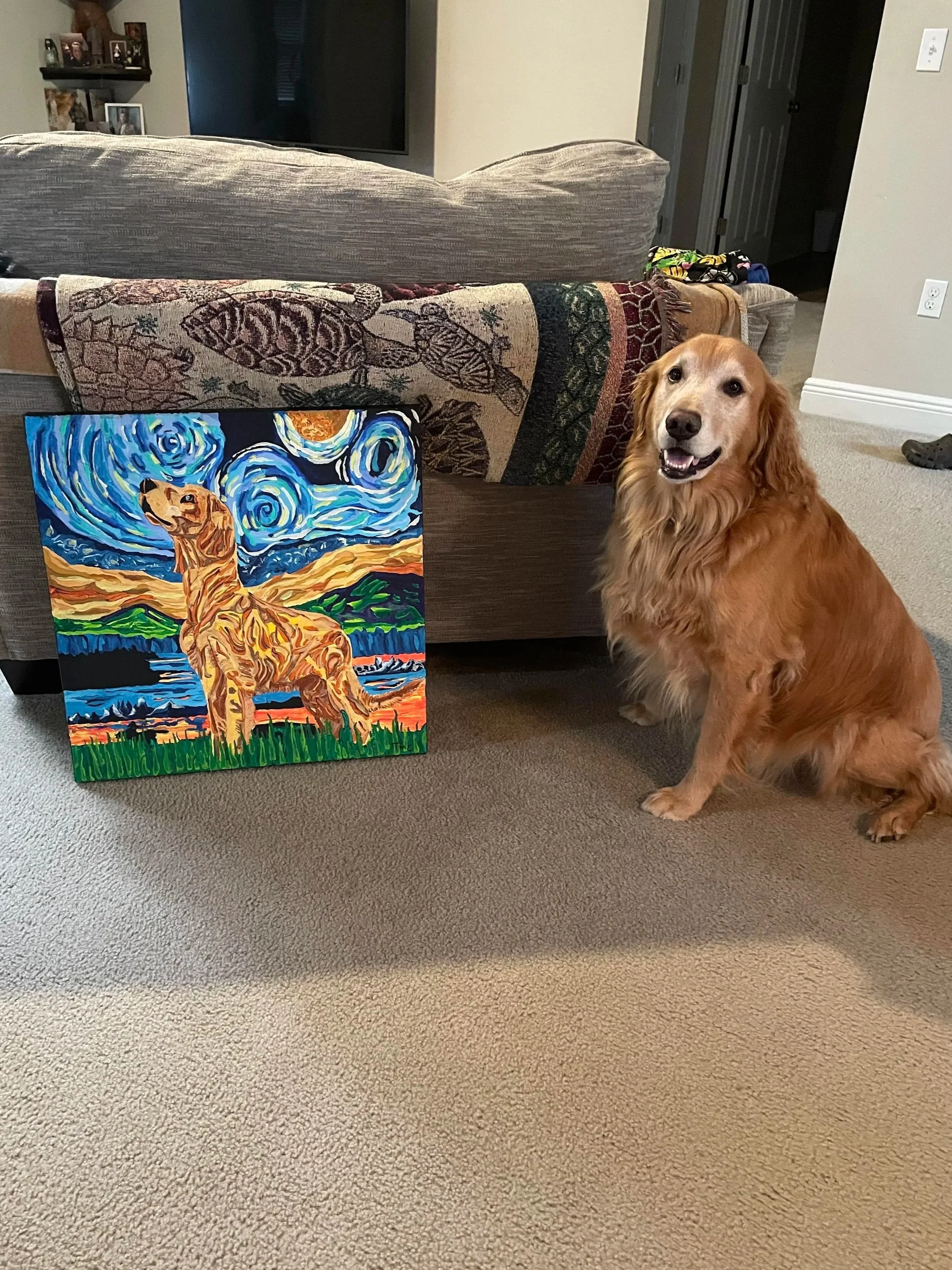 A dog sitting next to a colorful painting of a dog that resembles Vincent van Gogh's style, with swirling skies and landscape in the background.