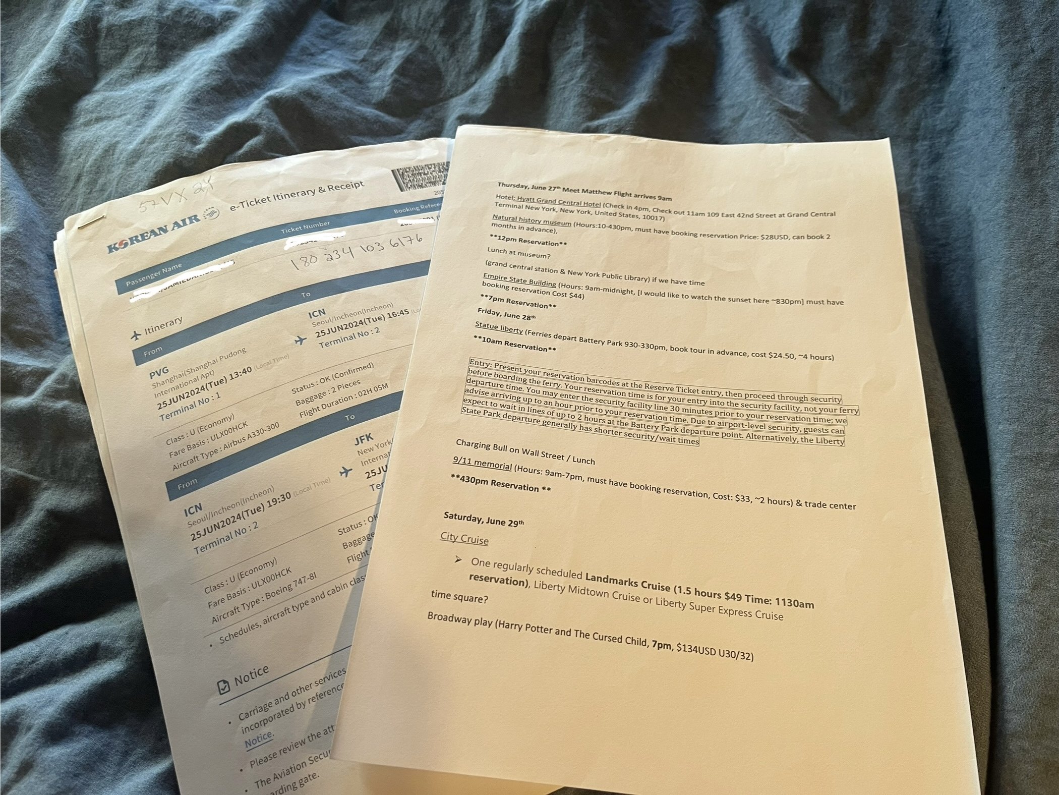 Printed flight itinerary, travel itinerary, and travel documents prepared before an international trip as paper backups for important travel information.
