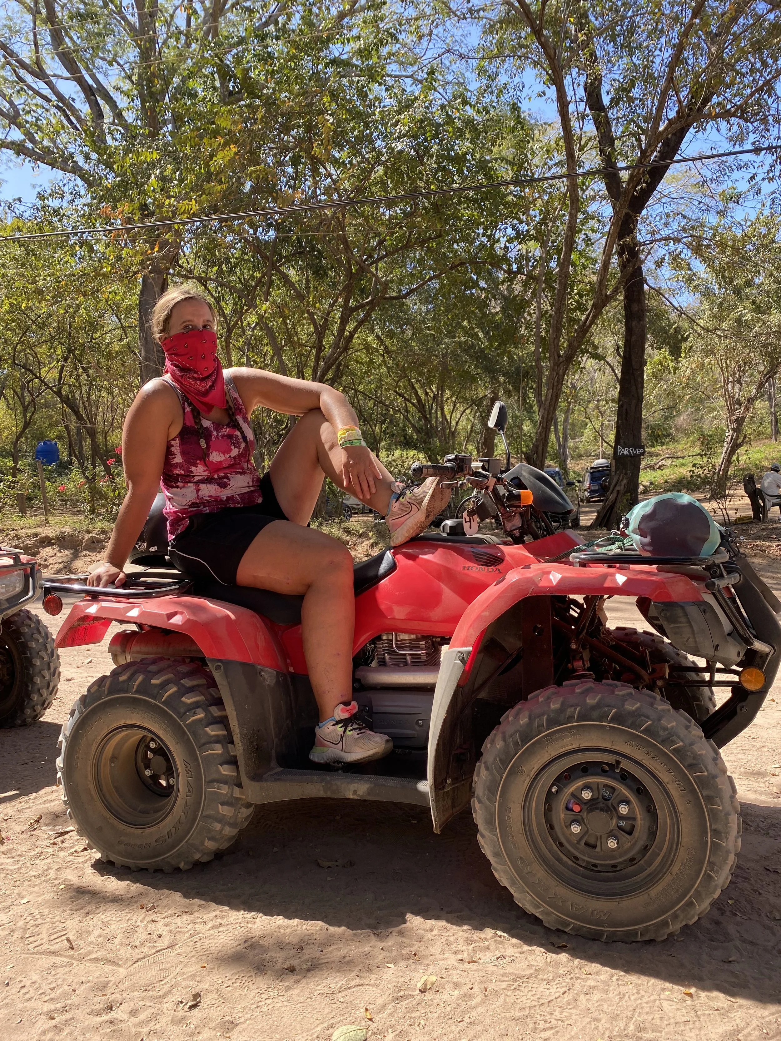 Traveller sitting on an ATV before an off-road tour in Tamarindo, Costa Rica.