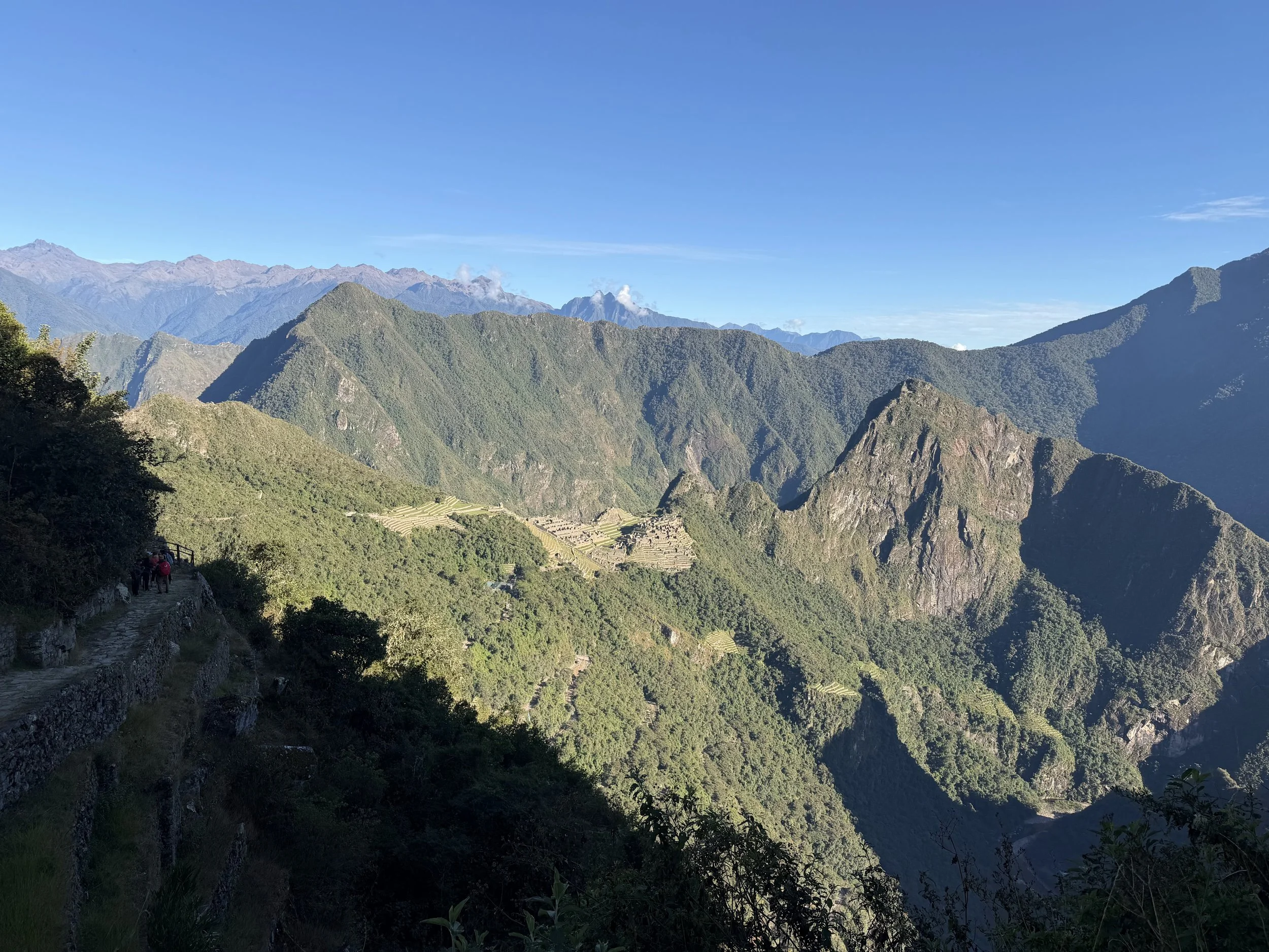 View of Machu Picchu in Peru surrounded by the Andes Mountains after taking a quiet moment to appreciate the landscape before photographing it.