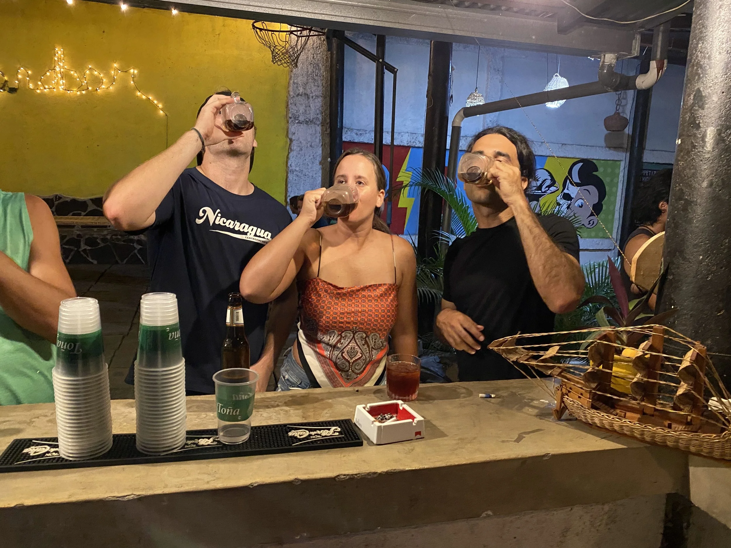 Travelers taking shots at a bar in Granada Nicaragua during a night out