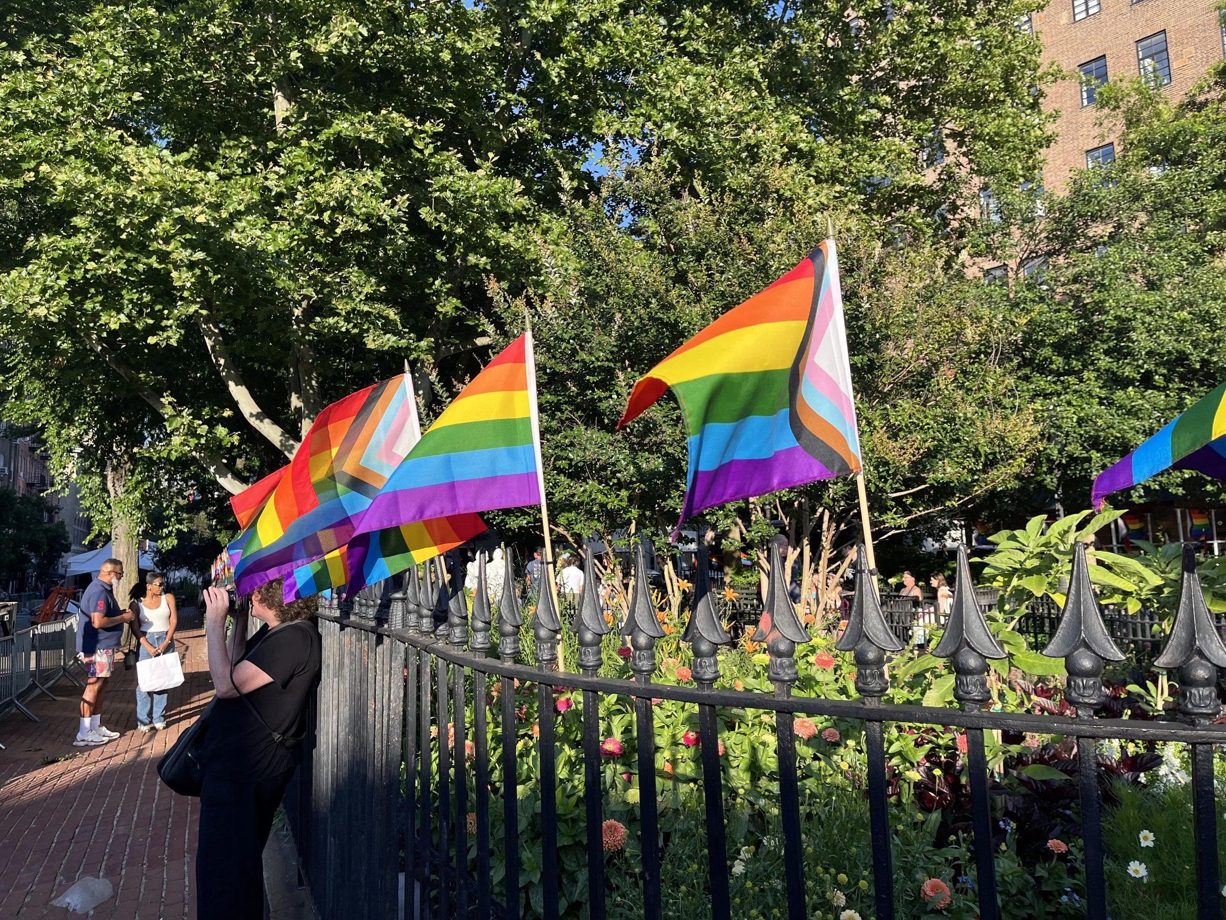 Pride flags displayed outside Stonewall in New York City during Pride weekend.